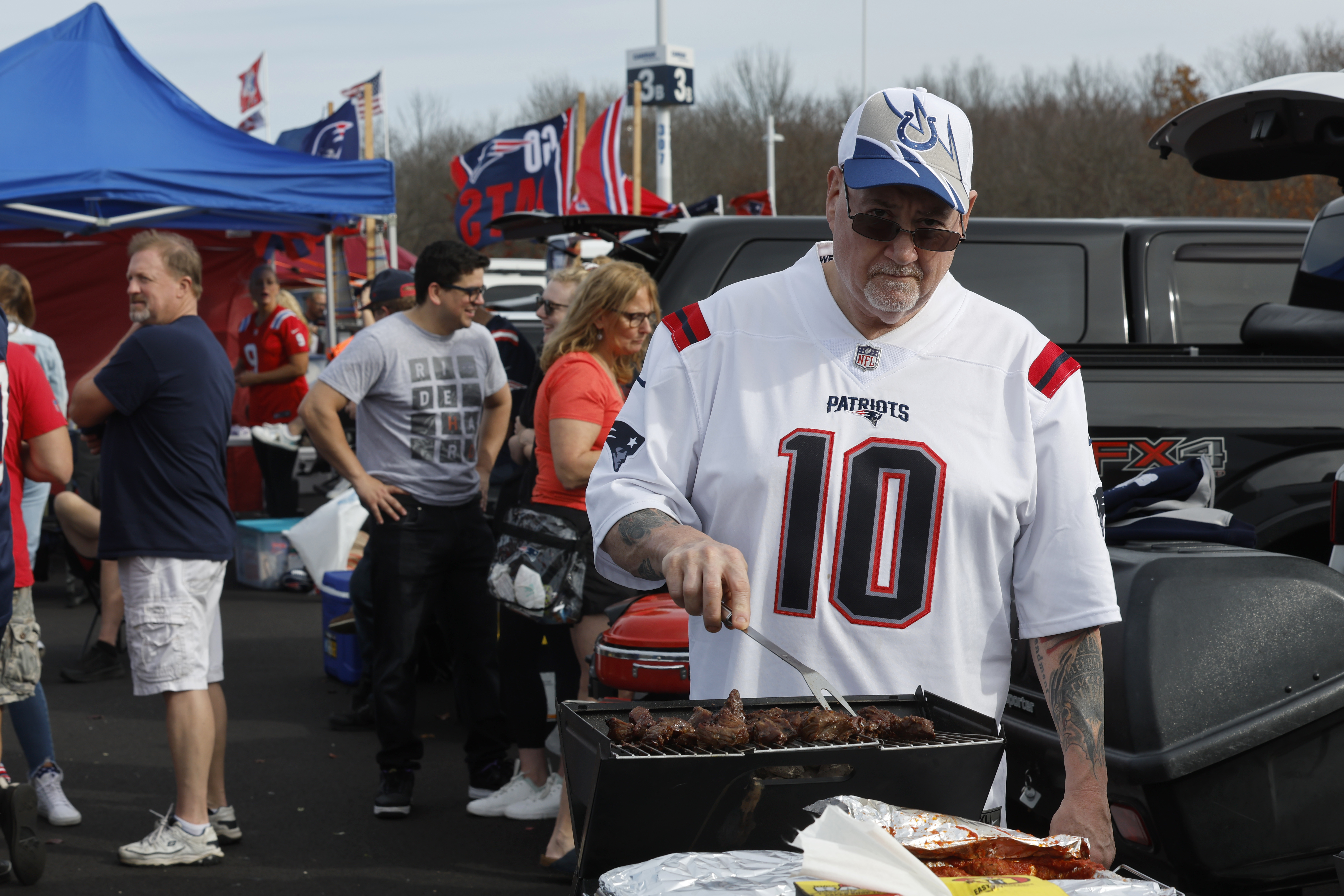 Fans tailgate before an NFL football game.