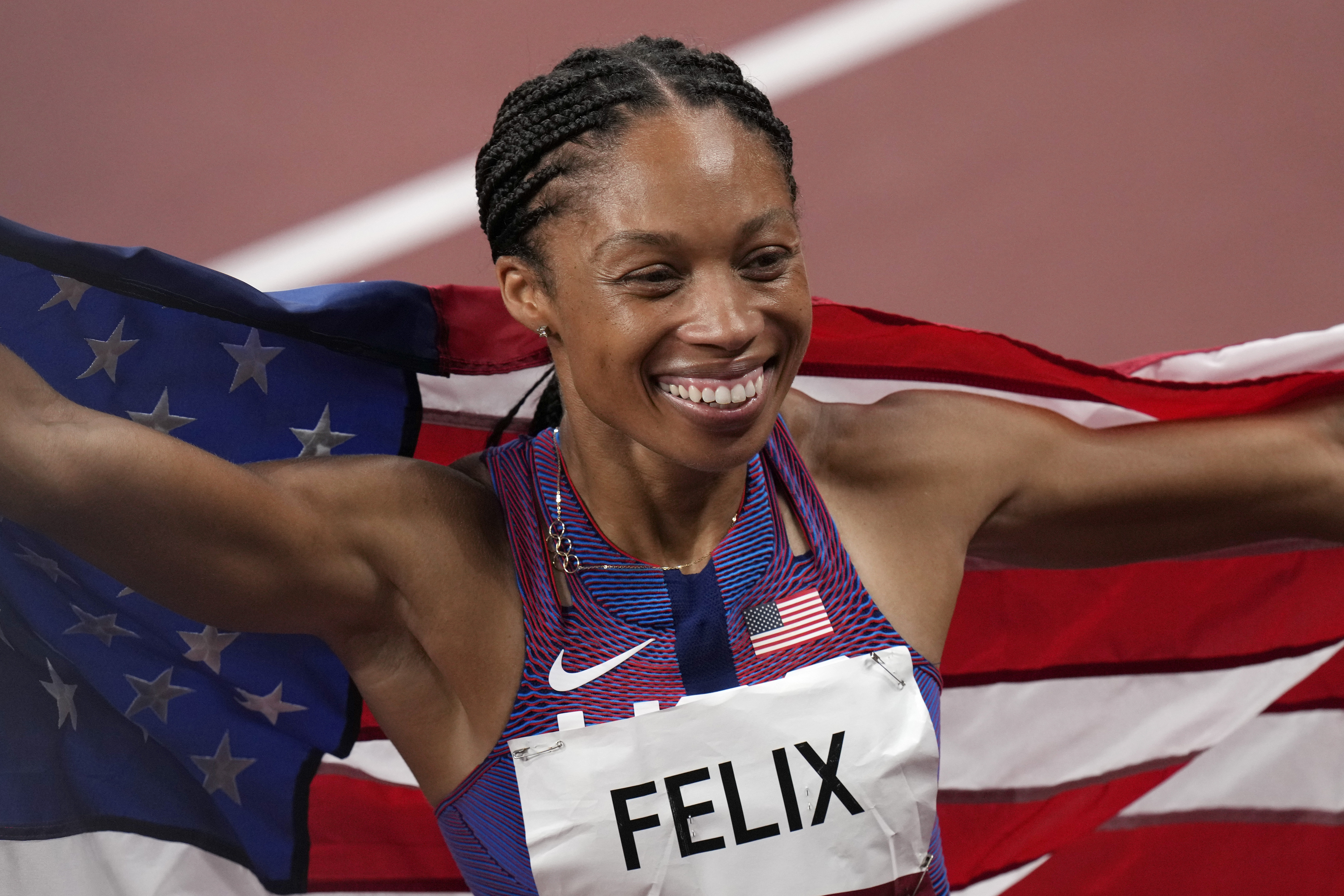 Allyson Felix, of the United States, smiles after taking the bronze medal.