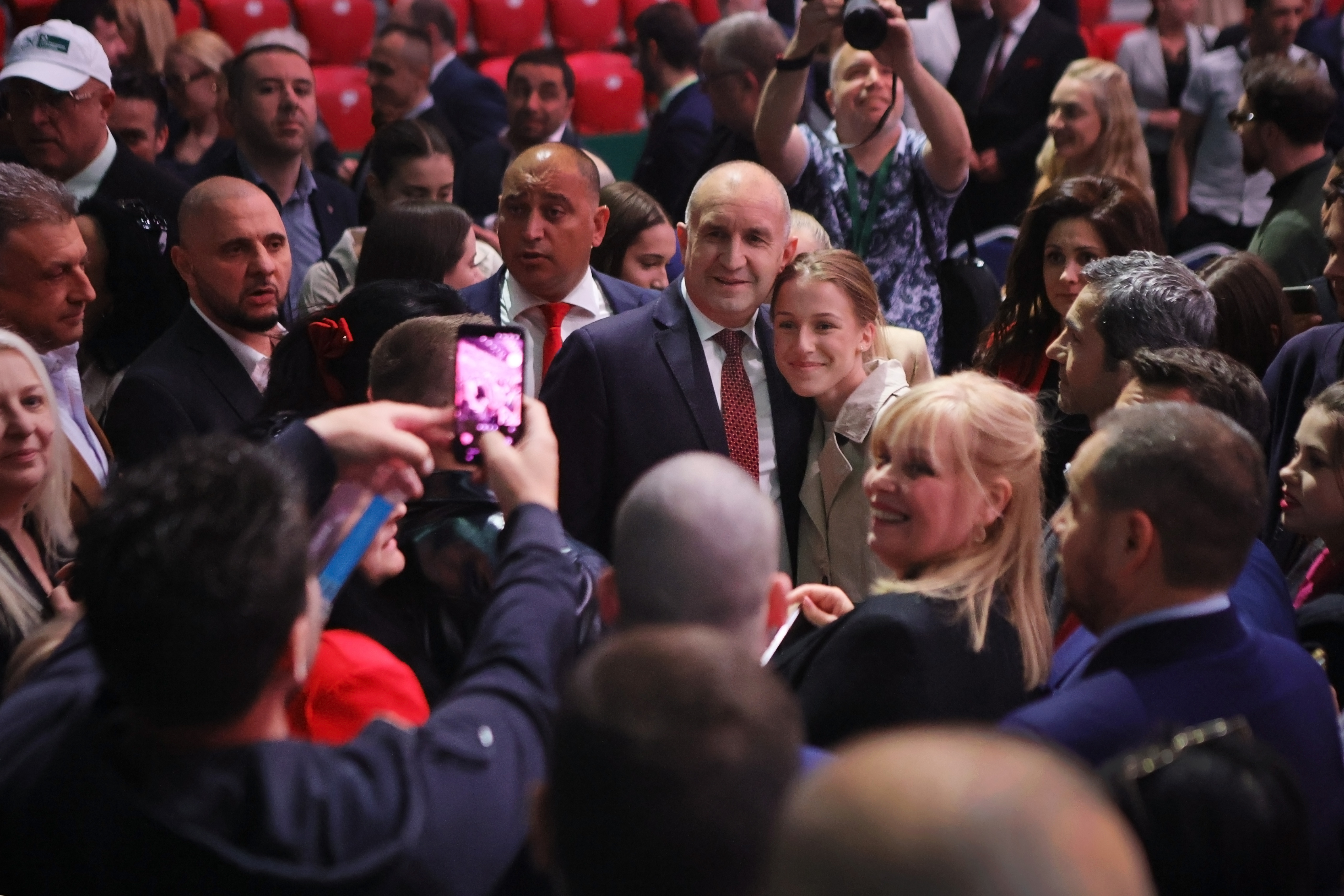 Former Bulgarian President Rumen Radev poses with a supporter at the closing rally of his election campaign, in Sofia, on Thursday, April 16, 2026, as Bulgaria heads into an early parliamentary election