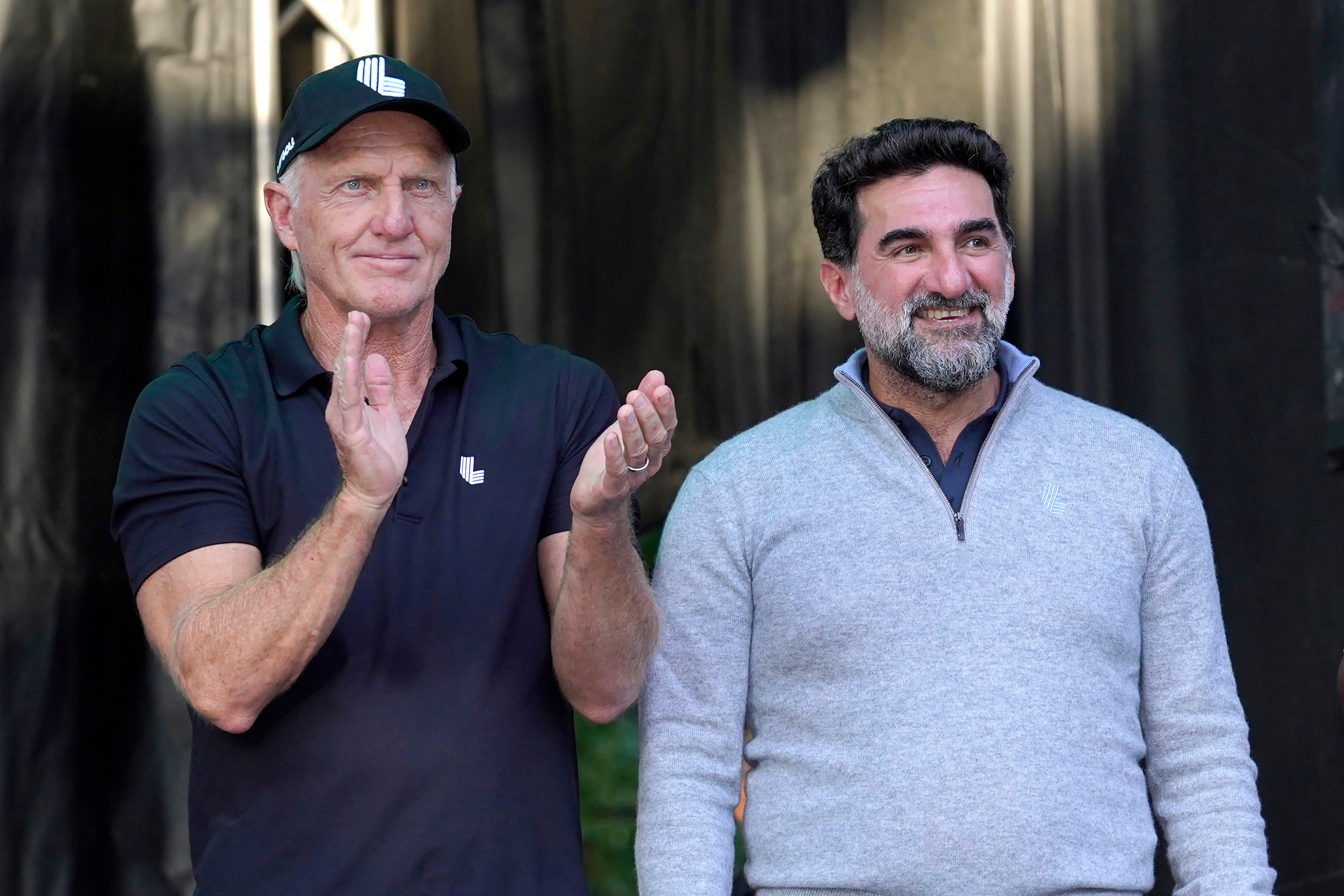 LIV Golf CEO Greg Norman, left, applauds Yasir Al-Rumayyan, Governor of Public Investment Fund of Saudi Arabia, at the LIV Golf Invitational-Chicago tournament
