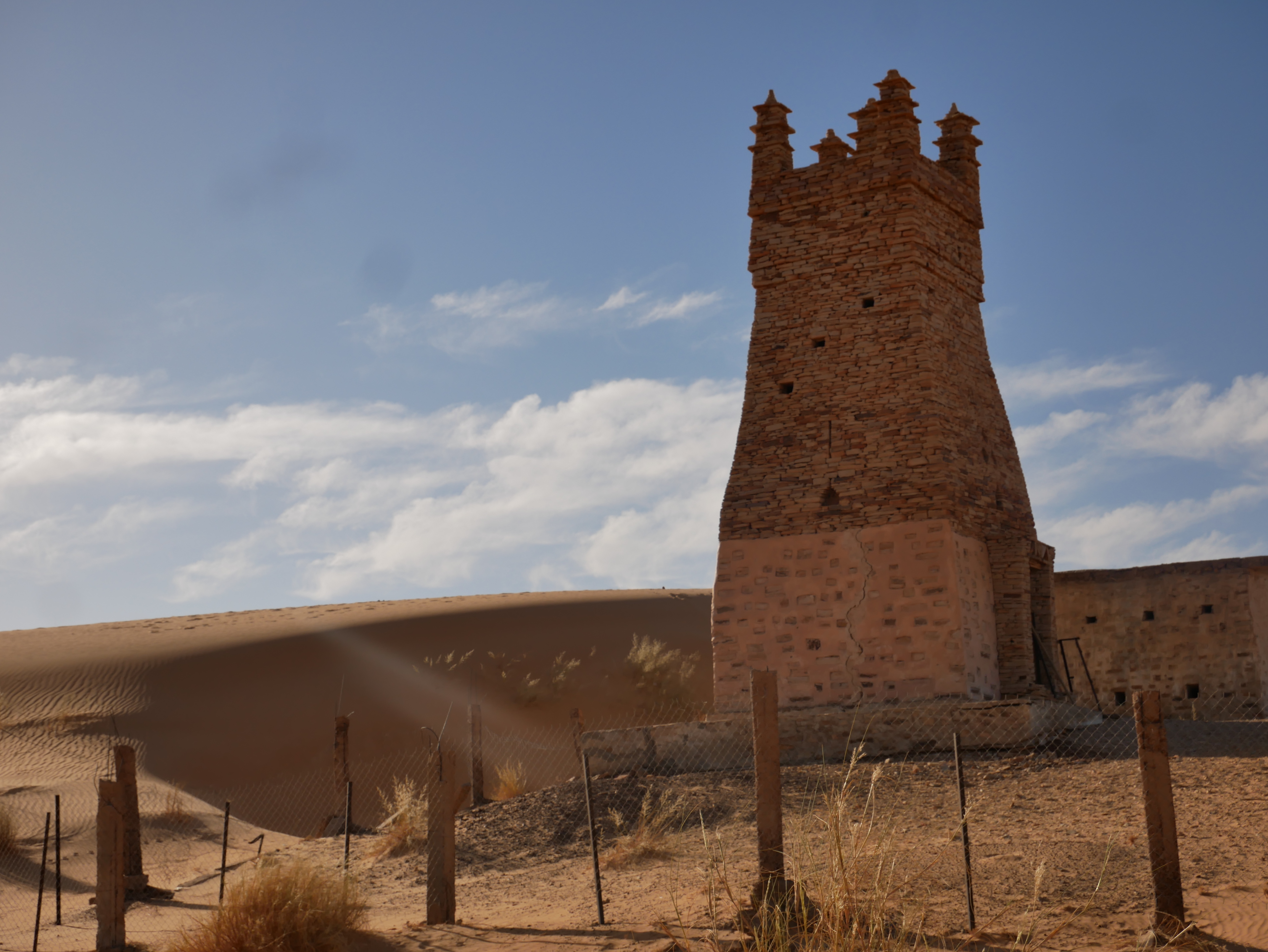 An excavated mosque of Abweir, just outside Chinguetti, stands next to a sand dune. The settlement was believed to be the ‘original’ Chinguetti before residents moved for unclear reasons