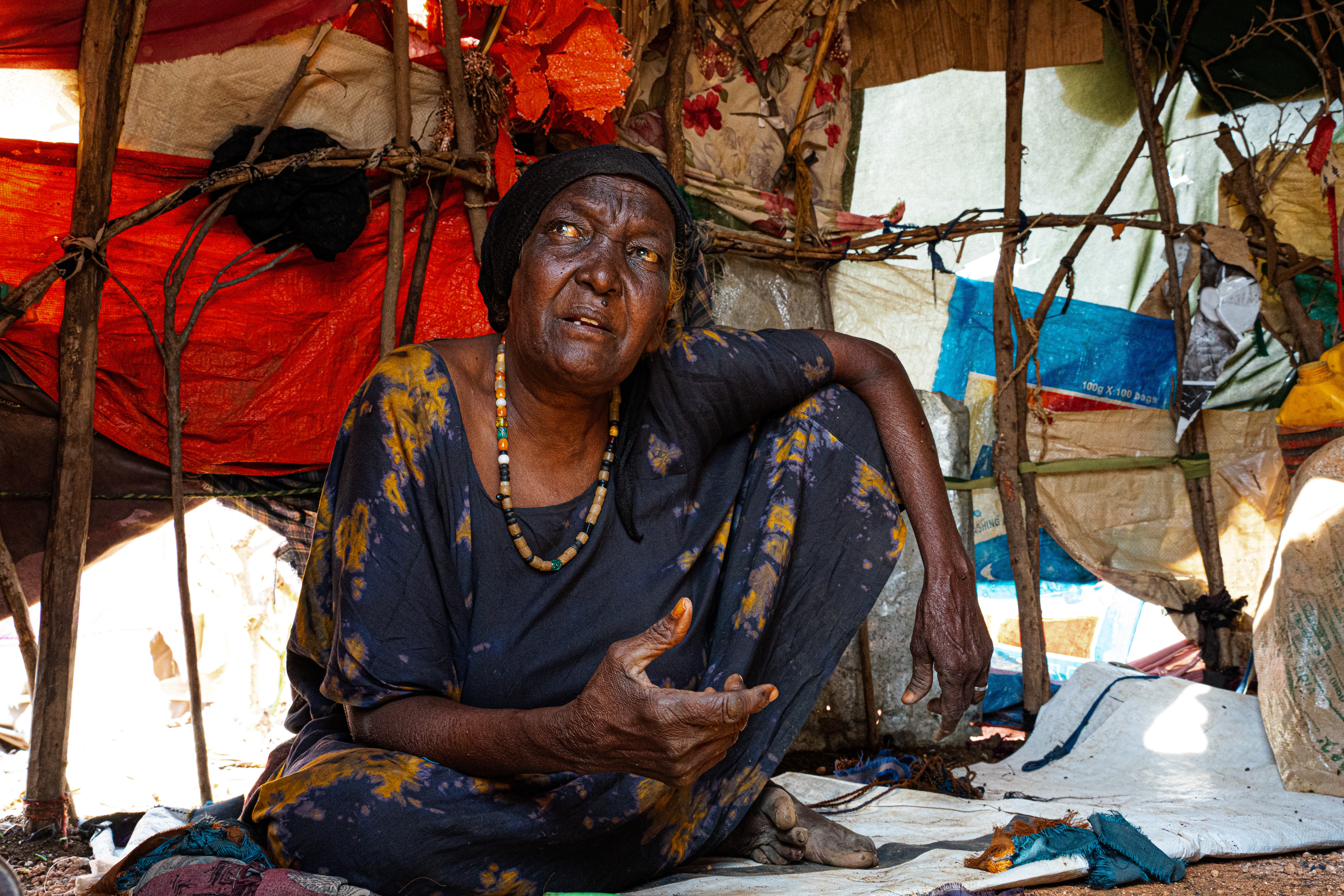 Muslima Hussein, 68, was displaced from the Bakool region after the drought turned her farm barren and killed her livestock. At her age, the journey on foot alongside her daughter took days. The relief she expected in Baidoa has not come. She now lives at Wayamo camp without proper shelter, food, or support. "Before the drought, we had livestock and a farm," she says. "Everything changed when we missed the rains. Now we have nothing." Her greatest concern is her grandchildren. "My grandchildren always cry for food, and I cannot help them." Wayamo displacement camp, Baidoa, Southwest State, Somalia. [Abdulkadir Mohamed/NRC]