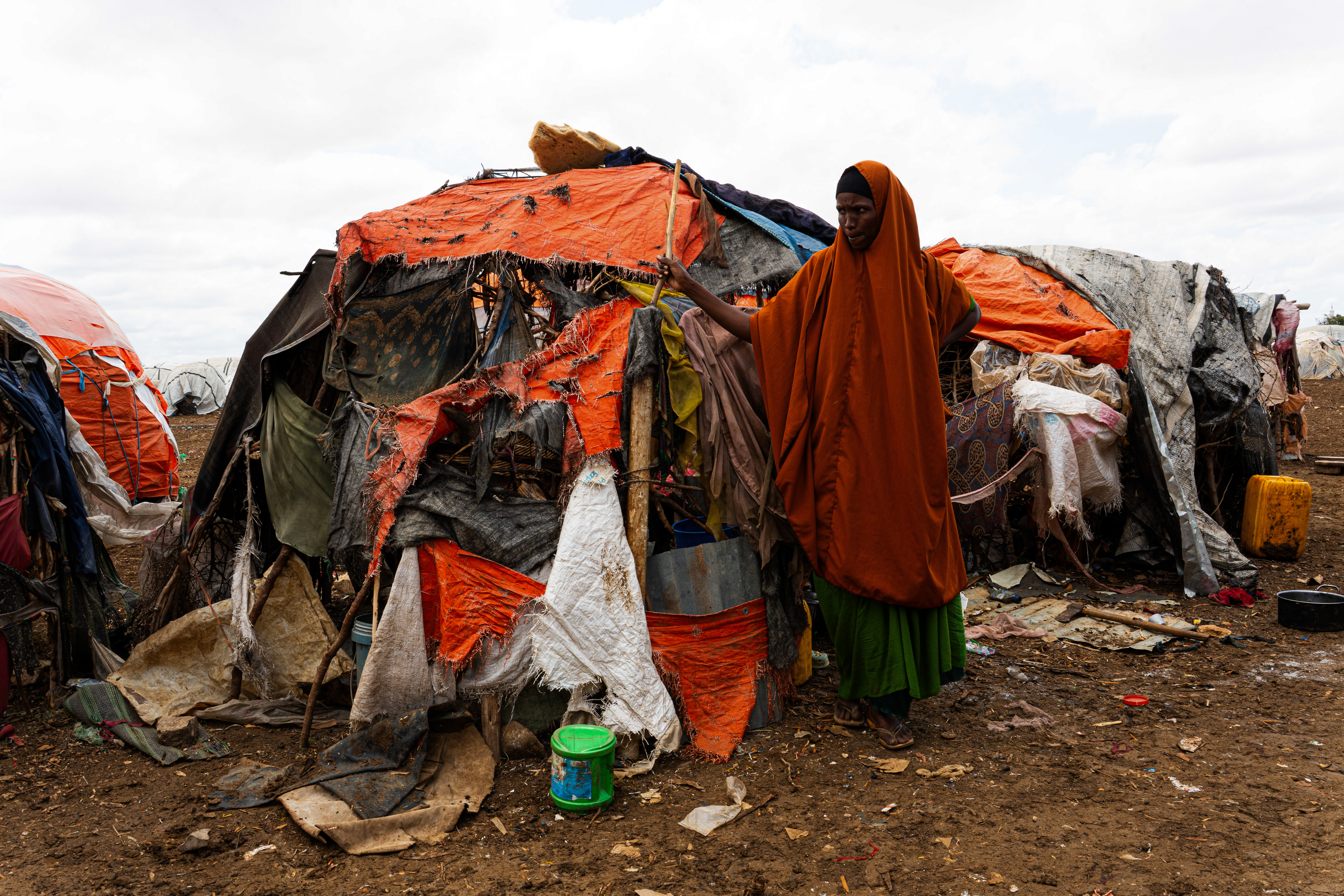 Hawa Moalim, 33, fled Wajid in the Bakool region after the drought destroyed her livelihood. She began the journey to Baidoa with her six children and the few goats that had survived, determined to give her family a chance. One by one, the animals died on the road. By the time the family arrived at Wayamo displacement camp two weeks ago, they had nothing left. "We arrived here hoping for help," she says. "But since we came, we have received nothing. There is no food, no water, and no proper shelter." Wayamo displacement camp, Baidoa, Southwest State, Somalia. [Abdulkadir Mohamed/NRC]