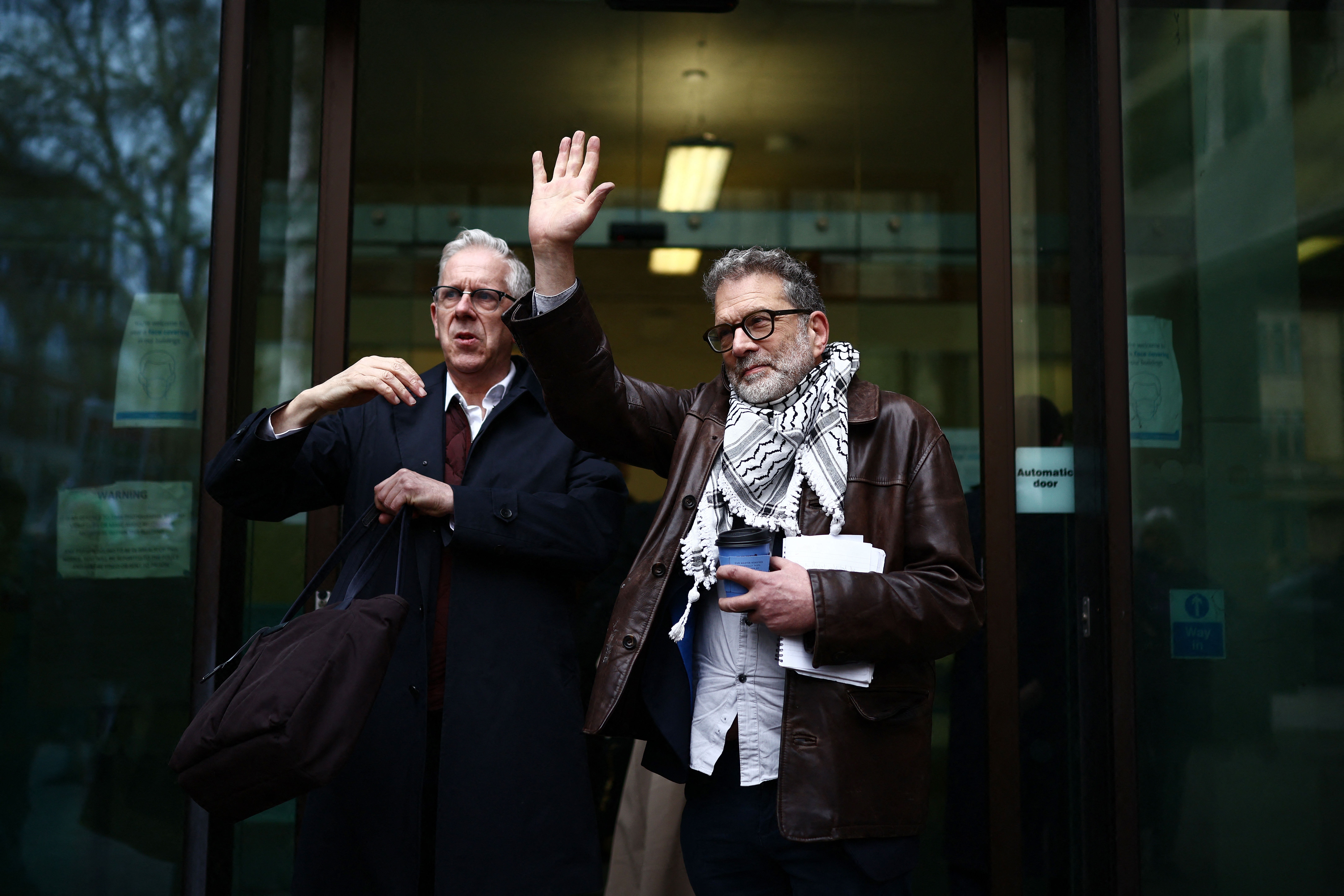 Ben Jamal, director of Palestine Solidarity Campaign (R), and Chris Nineham, vice chair of Stop the War Coalition, arrive at court.