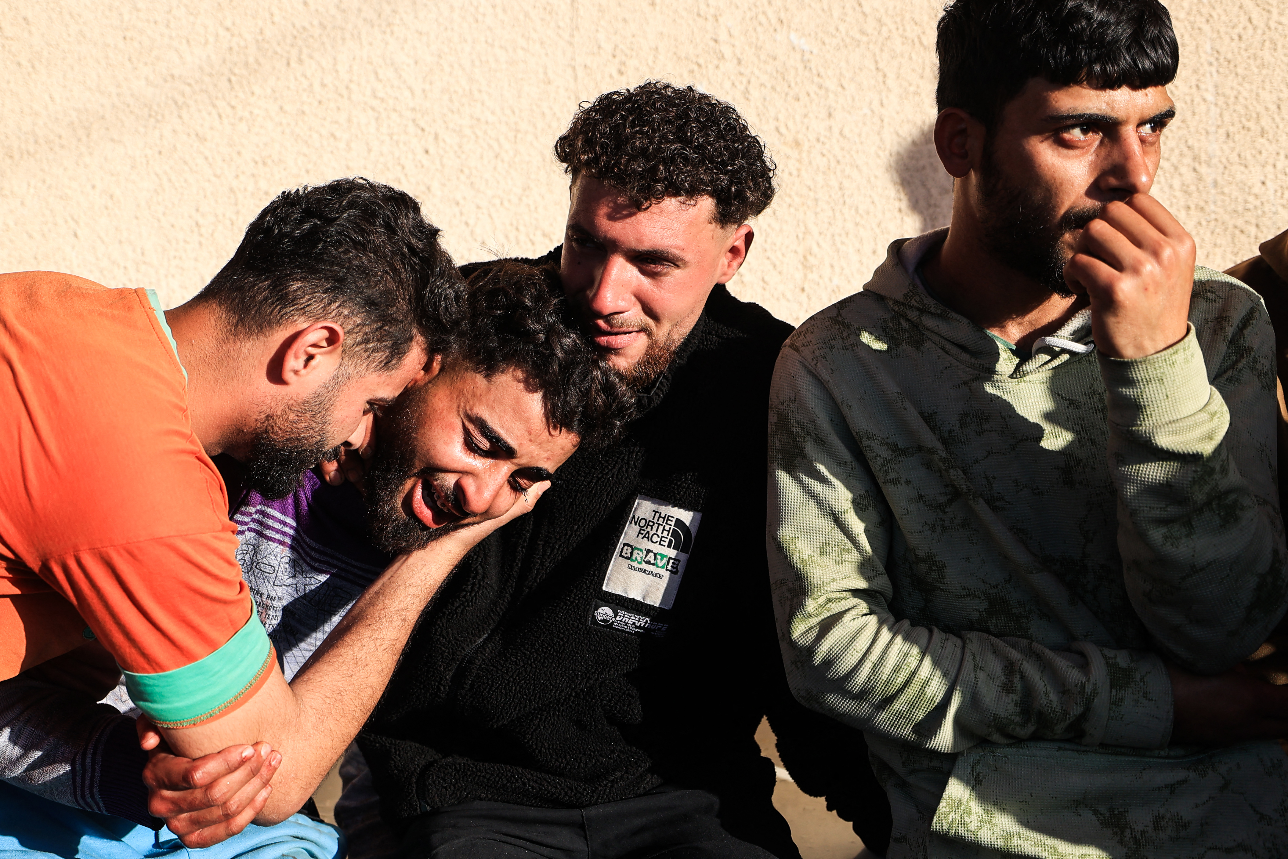 A family member reacts outside the Al-Aqsa Martyrs Hospital in Deir al-Balah, where victims have been brought following an Israeli strike on the Al-Maghazi refugee camp in the central Gaza Strip on April 6, 2026.