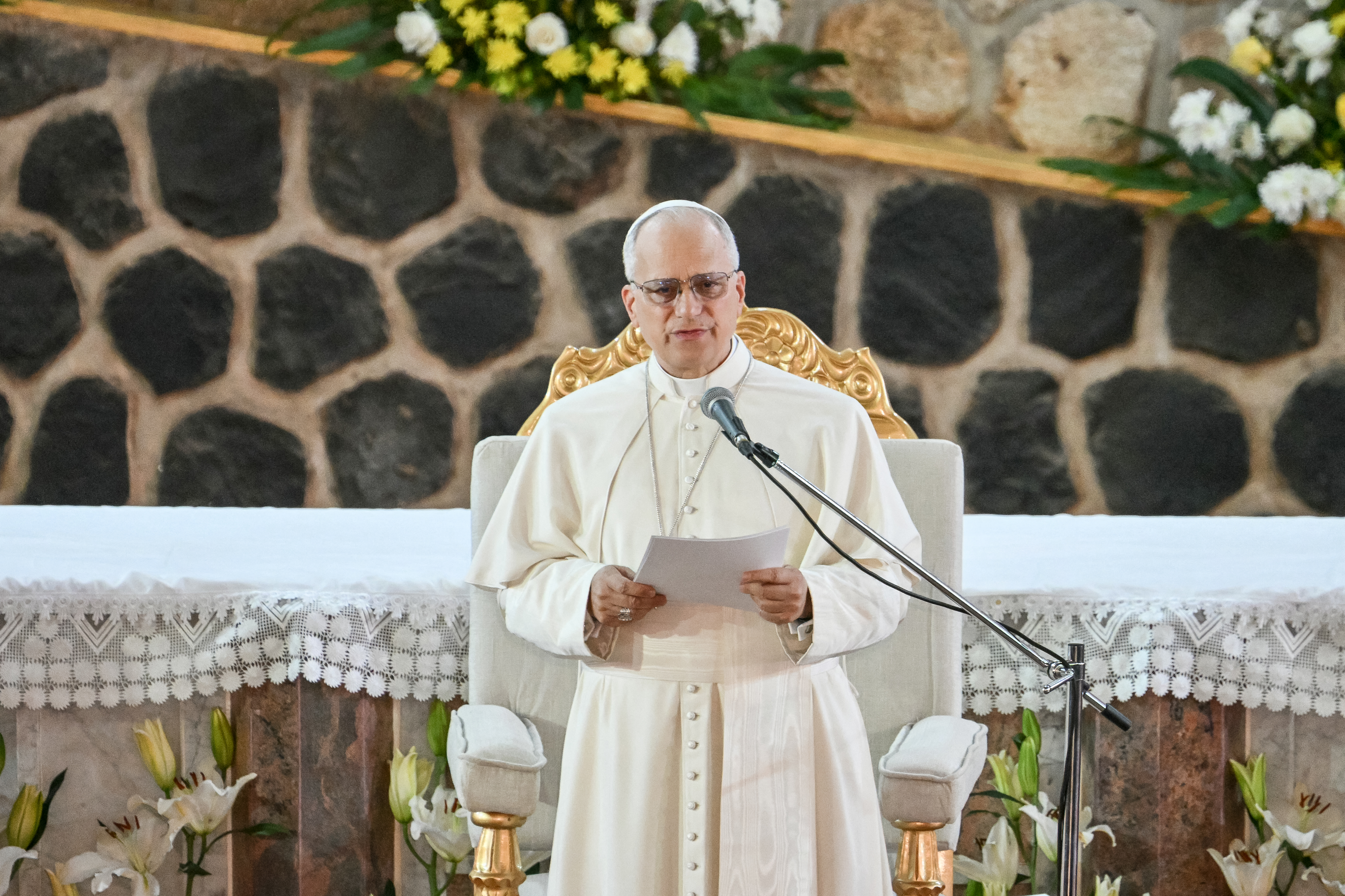 Pope Leo XIV speaks as he meets with the community of Bamenda at Saint Joseph's Cathedral in Bamenda, on the fourth day of an 11-day apostolic journey to Africa, on April 16, 2026. (Photo by Alberto PIZZOLI / AFP)