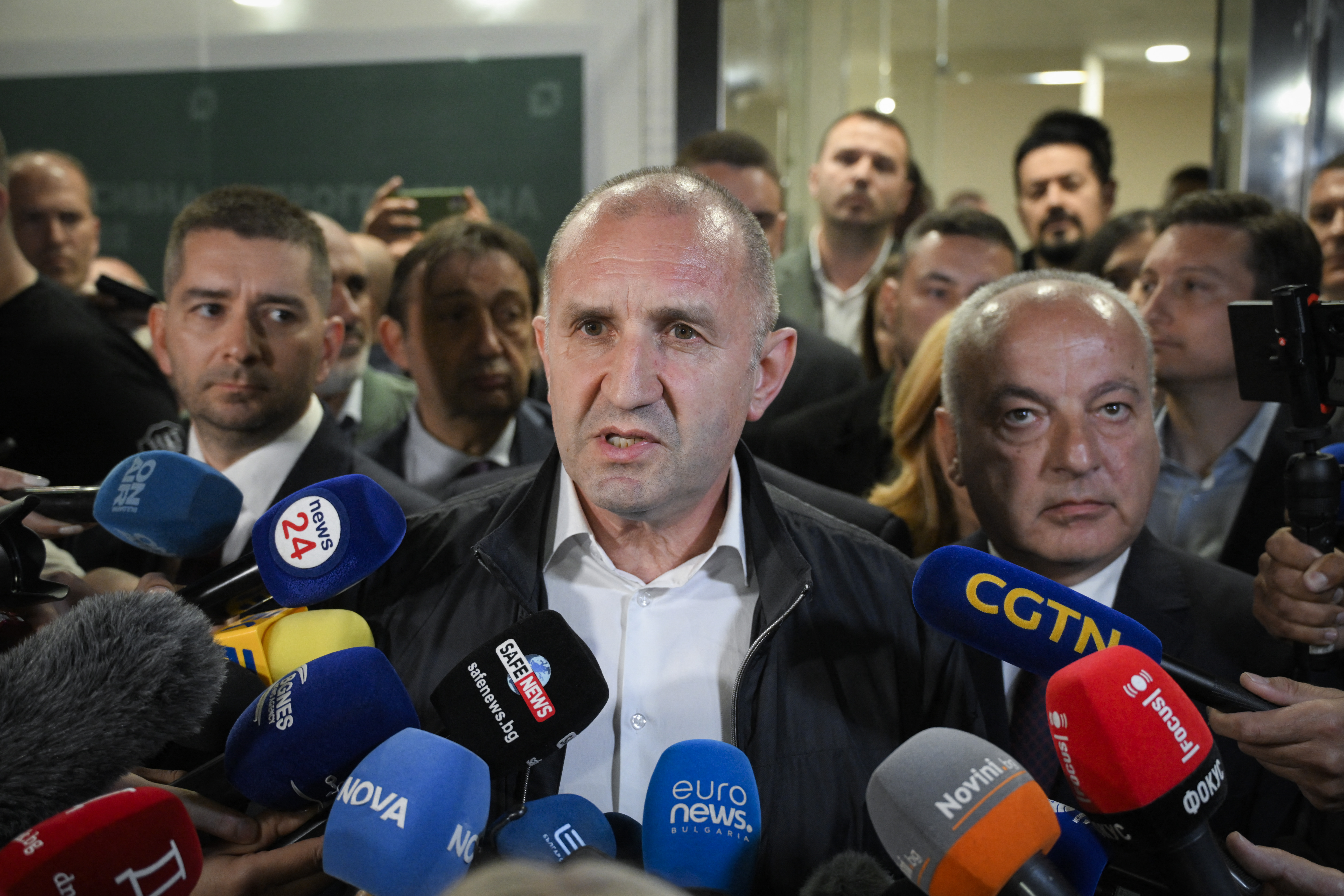 Rumen Radev speaks to the media at his party headquarters after polls closed in Bulgaria's parliamentary election, in Sofia