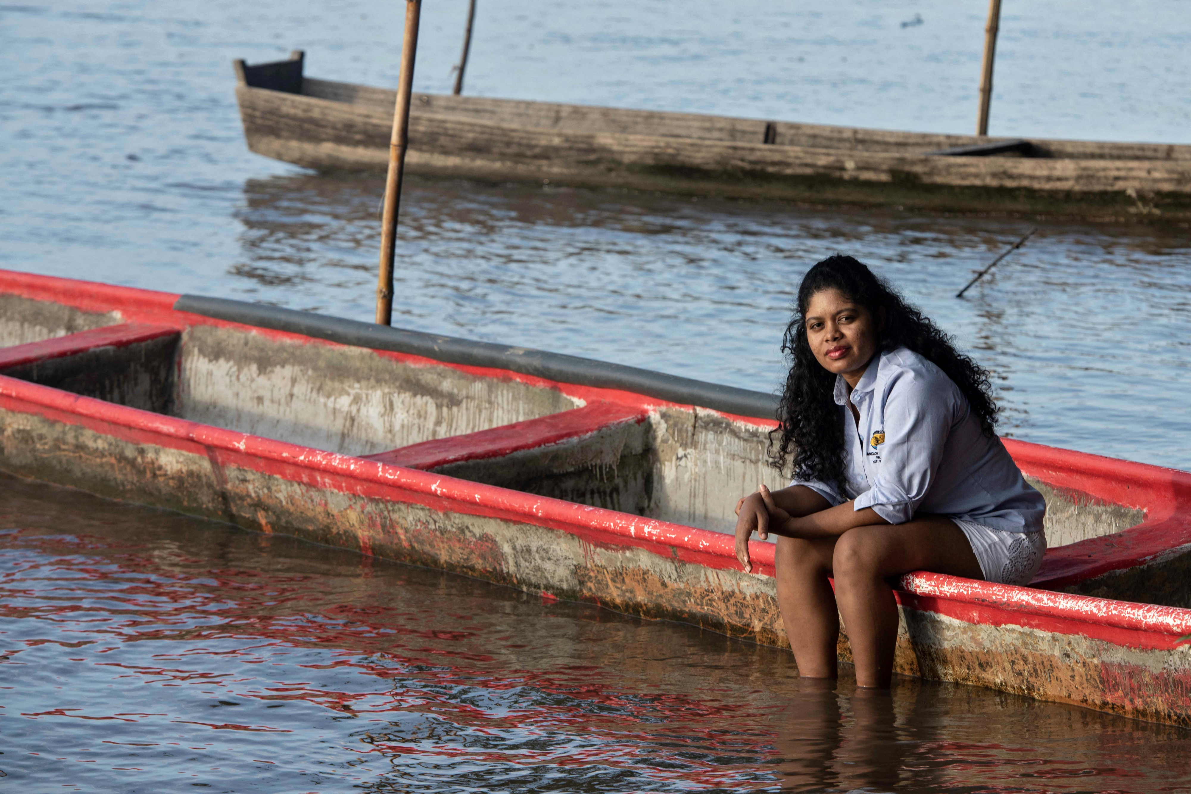 Handout photo provided by the Goldman Environmental Prize showing Colombian activist Yuvelis Morales Blanco, winner of its 2026 edition, sitting on a boat at the Magdalena River, by her house in Puerto Wilches, Santander department, Colombia, on January 29, 2026.