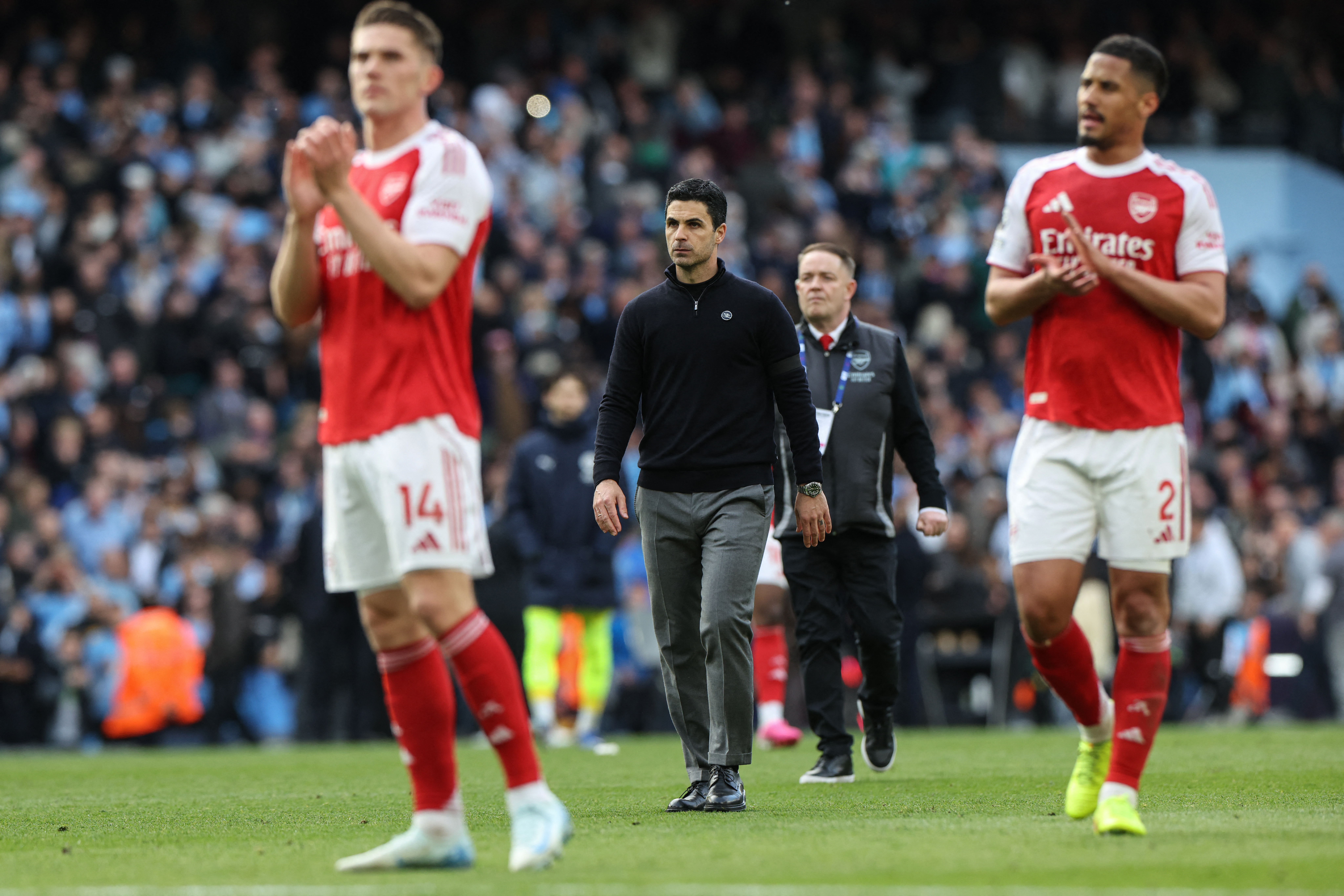 Arsenal's Spanish manager Mikel Arteta (C) reacts at the end of the English Premier League football match between Manchester City and Arsenal at the Etihad Stadium in Manchester, north west England, on April 19, 2026. (Photo by Darren Staples / AFP) / RESTRICTED TO EDITORIAL USE. NO USE WITH UNAUTHORIZED AUDIO, VIDEO, DATA, FIXTURE LISTS, CLUB/LEAGUE LOGOS OR 'LIVE' SERVICES. ONLINE IN-MATCH USE LIMITED TO 120 IMAGES. AN ADDITIONAL 40 IMAGES MAY BE USED IN EXTRA TIME. NO VIDEO EMULATION. SOCIAL MEDIA IN-MATCH USE LIMITED TO 120 IMAGES. AN ADDITIONAL 40 IMAGES MAY BE USED IN EXTRA TIME. NO USE IN BETTING PUBLICATIONS, GAMES OR SINGLE CLUB/LEAGUE/PLAYER PUBLICATIONS.