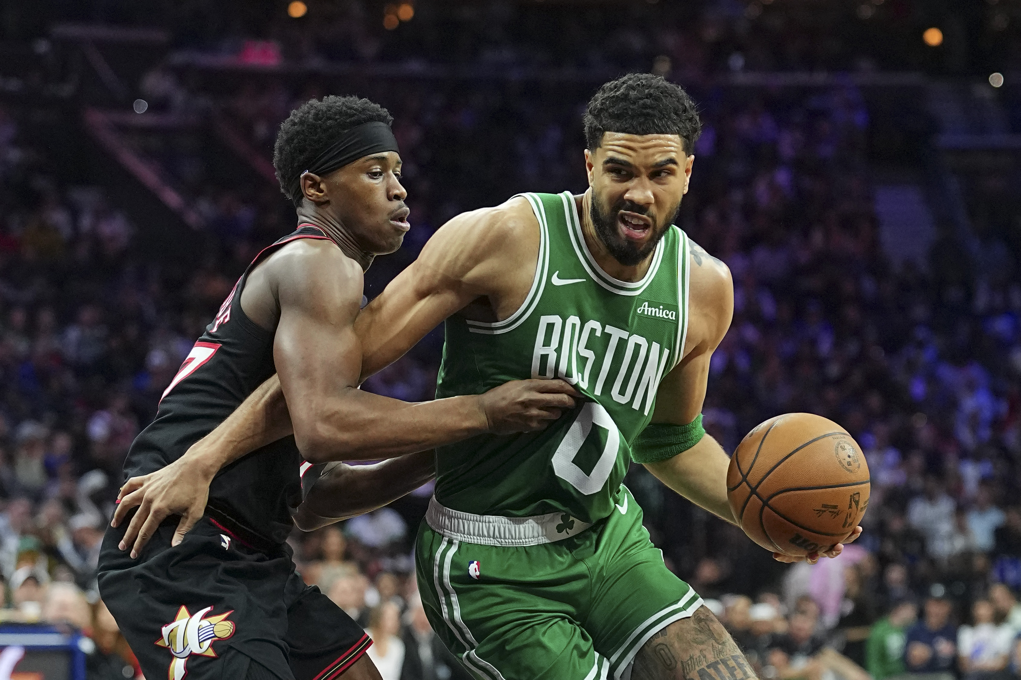 PHILADELPHIA, PENNSYLVANIA - APRIL 24: Jayson Tatum #0 of the Boston Celtics dribbles the ball against Vj Edgecombe #77 of the Philadelphia 76ers in the third quarter during game three of the Eastern Conference first round playoffs at Xfinity Mobile Arena on April 24, 2026 in Philadelphia, Pennsylvania. The Celtics defeated the 76ers 108-100. NOTE TO USER: User expressly acknowledges and agrees that, by downloading and or using this photograph, User is consenting to the terms and conditions of the Getty Images License Agreement. Mitchell Leff/Getty Images/AFP (Photo by Mitchell Leff / GETTY IMAGES NORTH AMERICA / Getty Images via AFP)