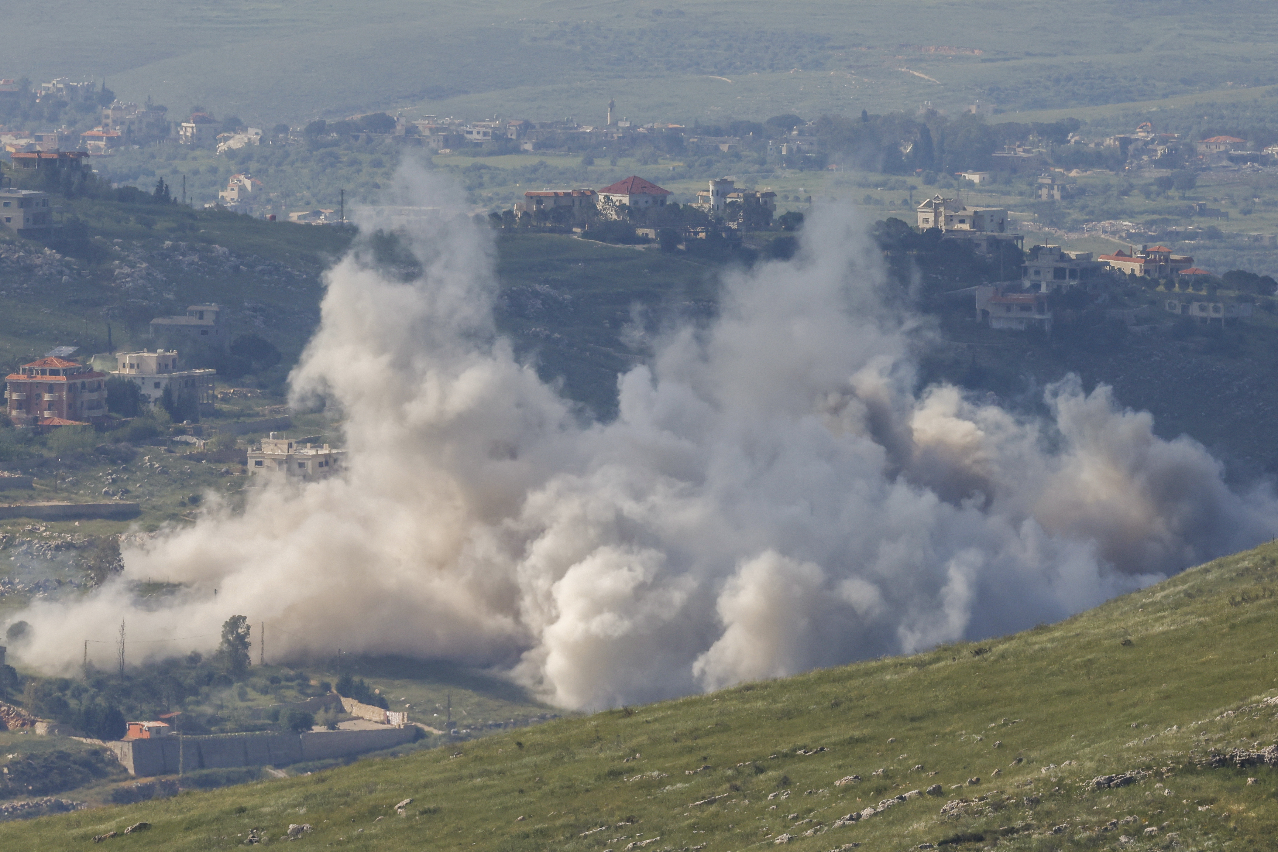Smoke rising from the hills.
