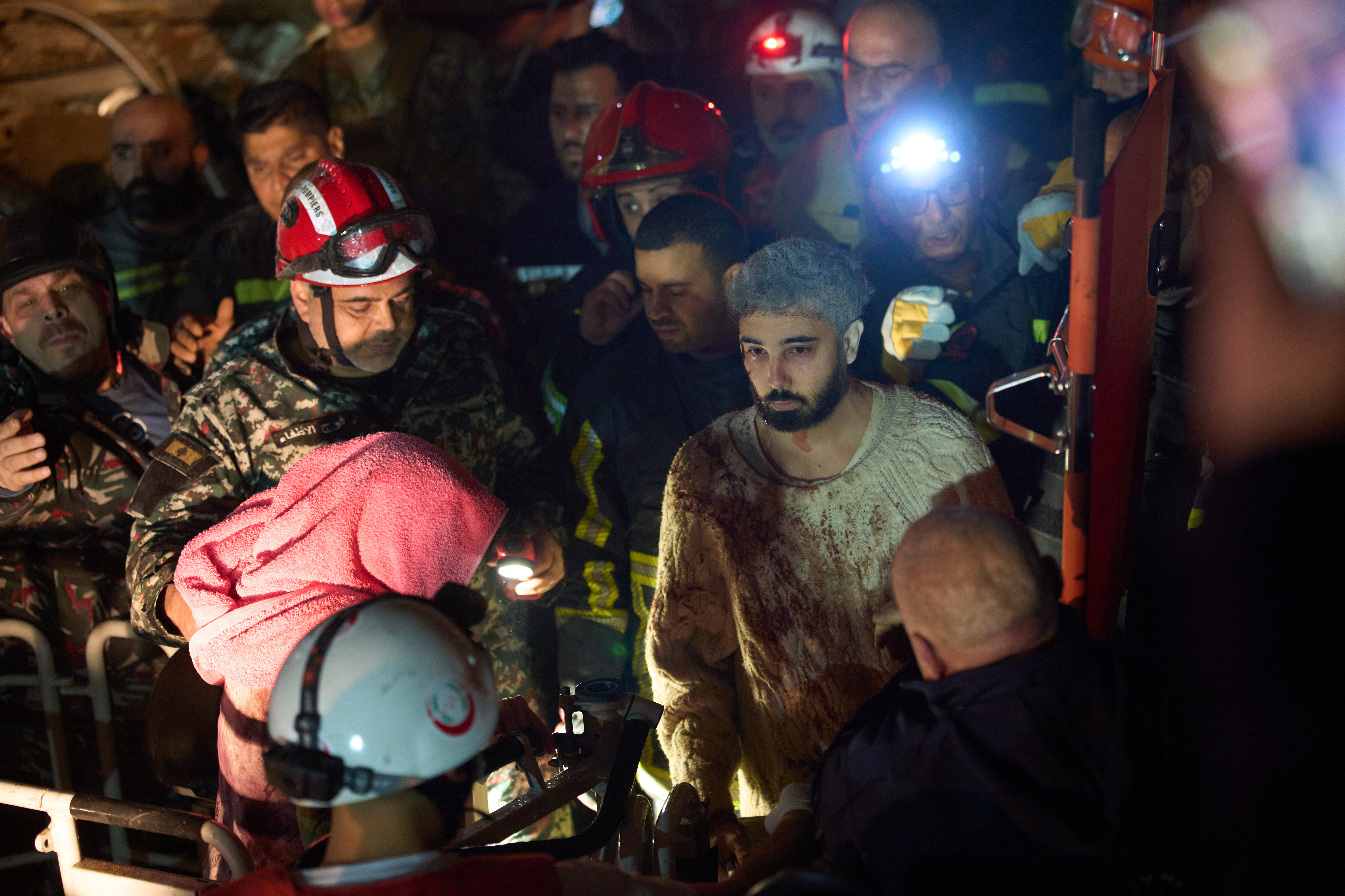 A man who survived an Israeli airstrike is rescued by a firefighter from a destroyed building in central Beirut, Lebanon, Wednesday, April 8, 2026. (AP Photo/Emilio Morenatti)