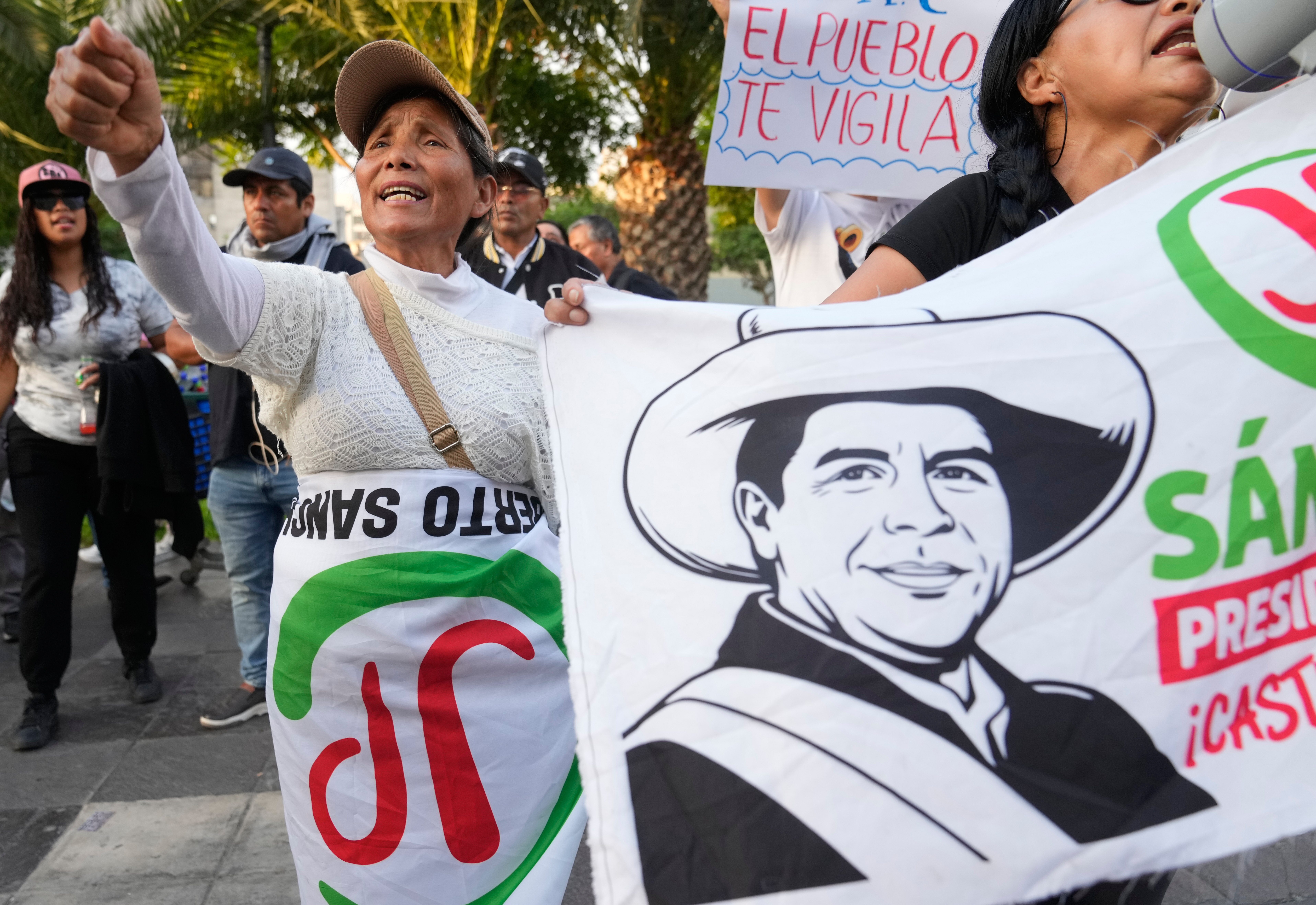 Supporters of presidential candidate Roberto Sanchez of the Together for Peru party demonstrate outside the National Office of Electoral Processes as they continue to count the votes four days after the general election, in Lima, Peru, Thursday, April 16, 2026. (AP Photo/Martin Mejia)