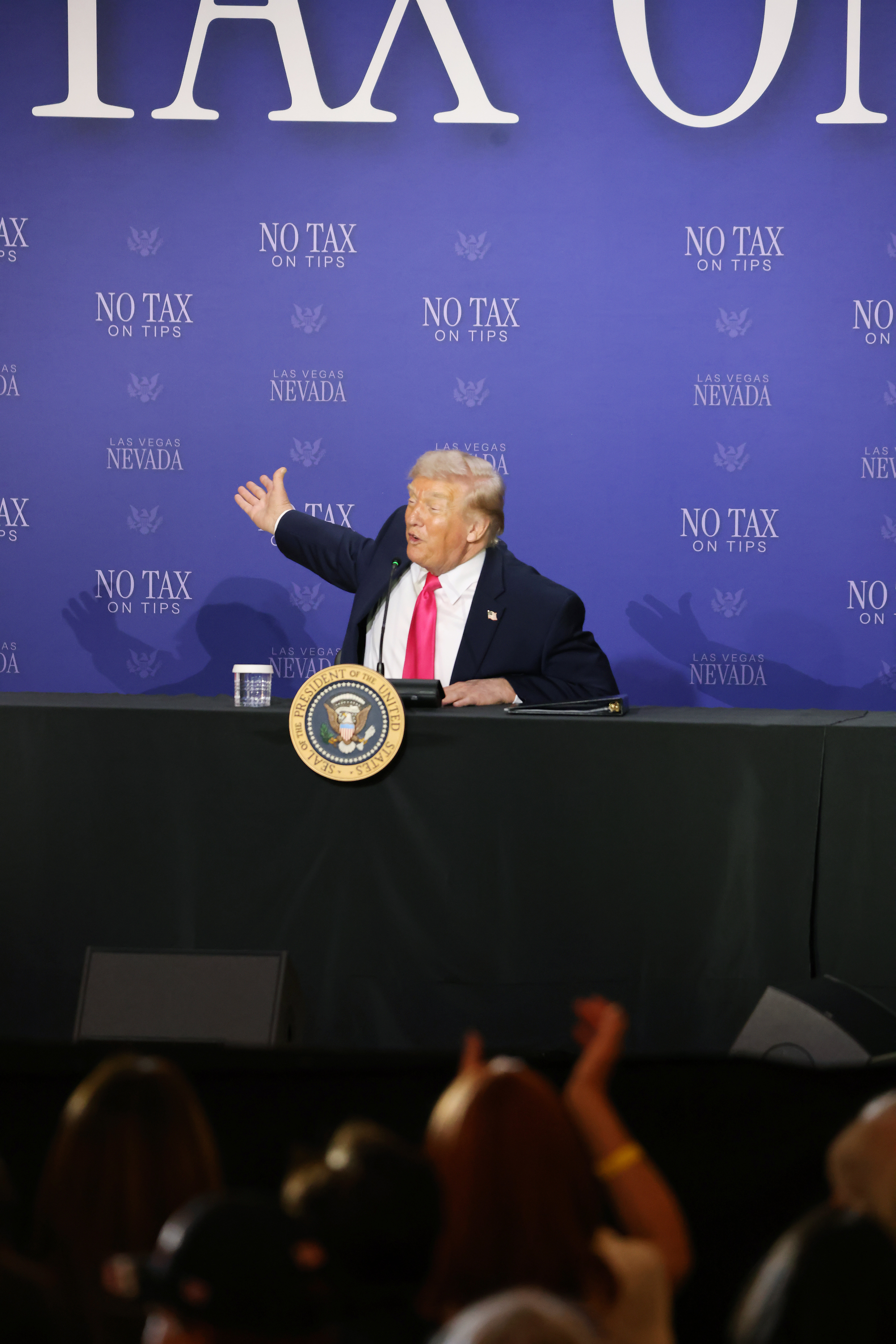 US President Donald Trump speaks at a podium.