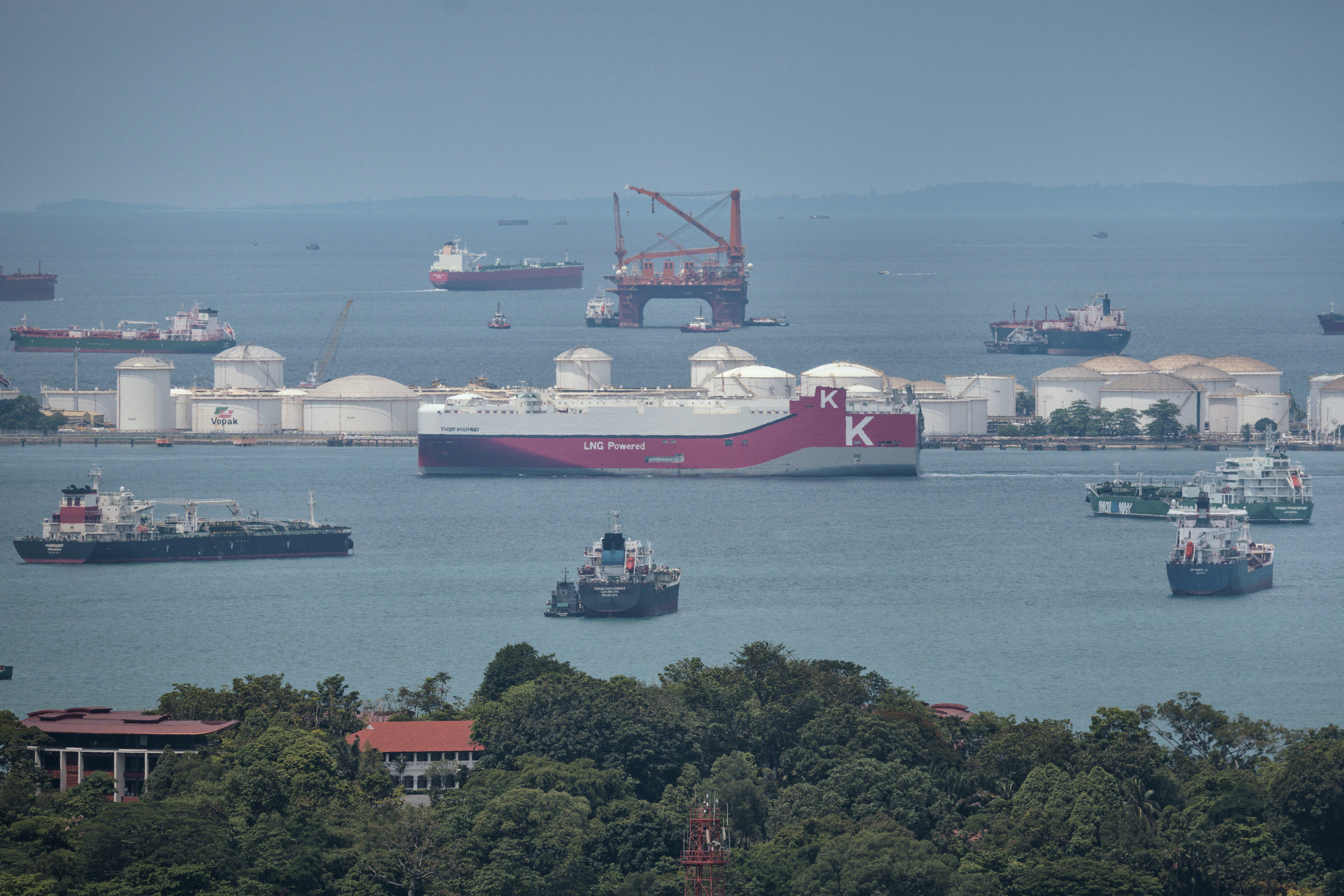 SINGAPORE, SINGAPORE - APRIL 06: A liquefied natural gas (LNG) tanker sails near the Sebarok Island oil storage terminal along the Singapore Strait on April 06, 2026 in Singapore. Singapore is strengthening its long-term energy resilience as the Iran conflict disrupts global supply routes, exposing vulnerabilities in import-dependent economies. The government has also formed a ministerial committee to address supply shocks and rising fuel and food prices. (Photo by Ezra Acayan/Getty Images)