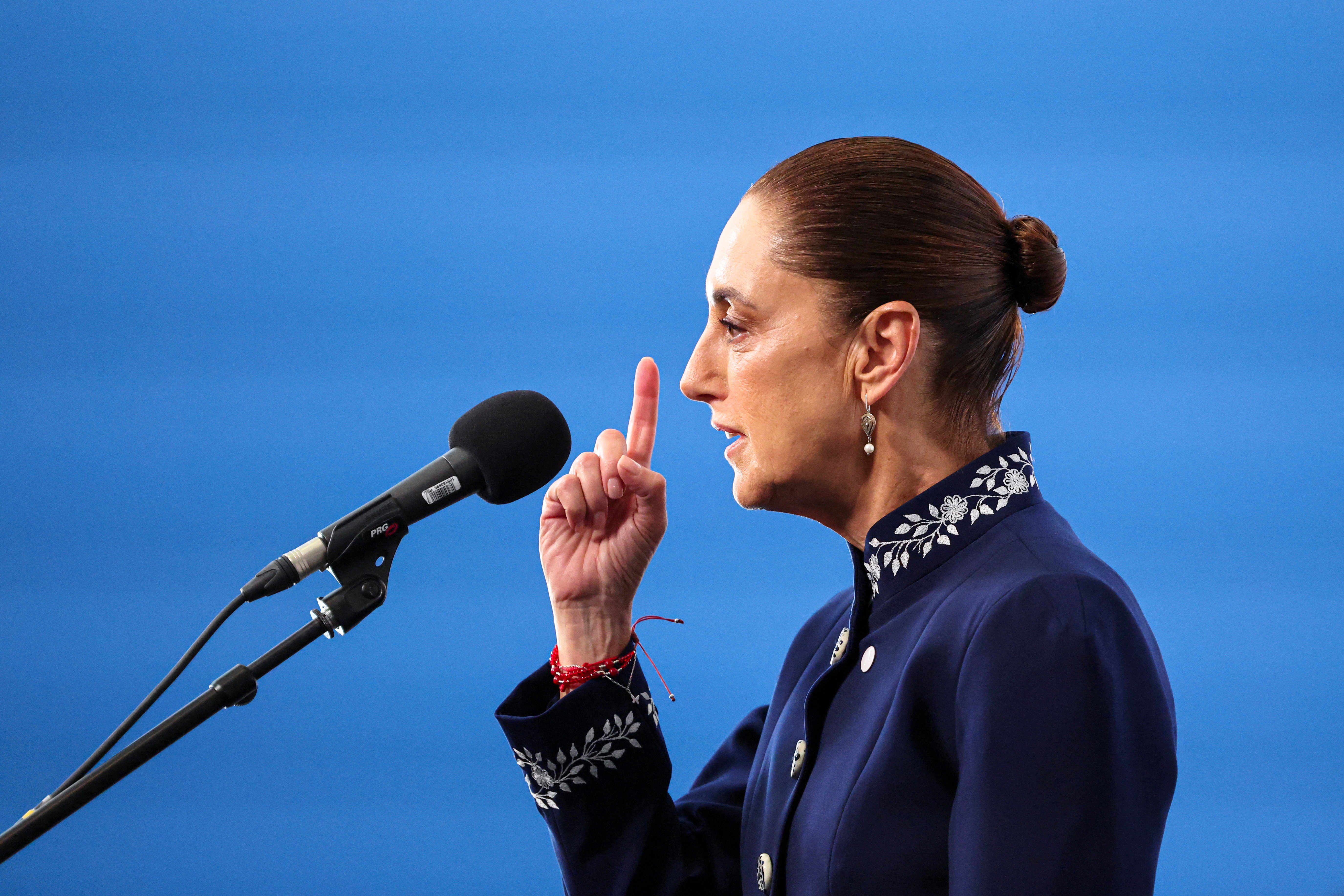 Mexico's President Claudia Sheinbaum speaks to the press as she arrives at the summit "In defence of democracy" in Barcelona, Spain, April 18, 2026. REUTERS/Nacho Doce