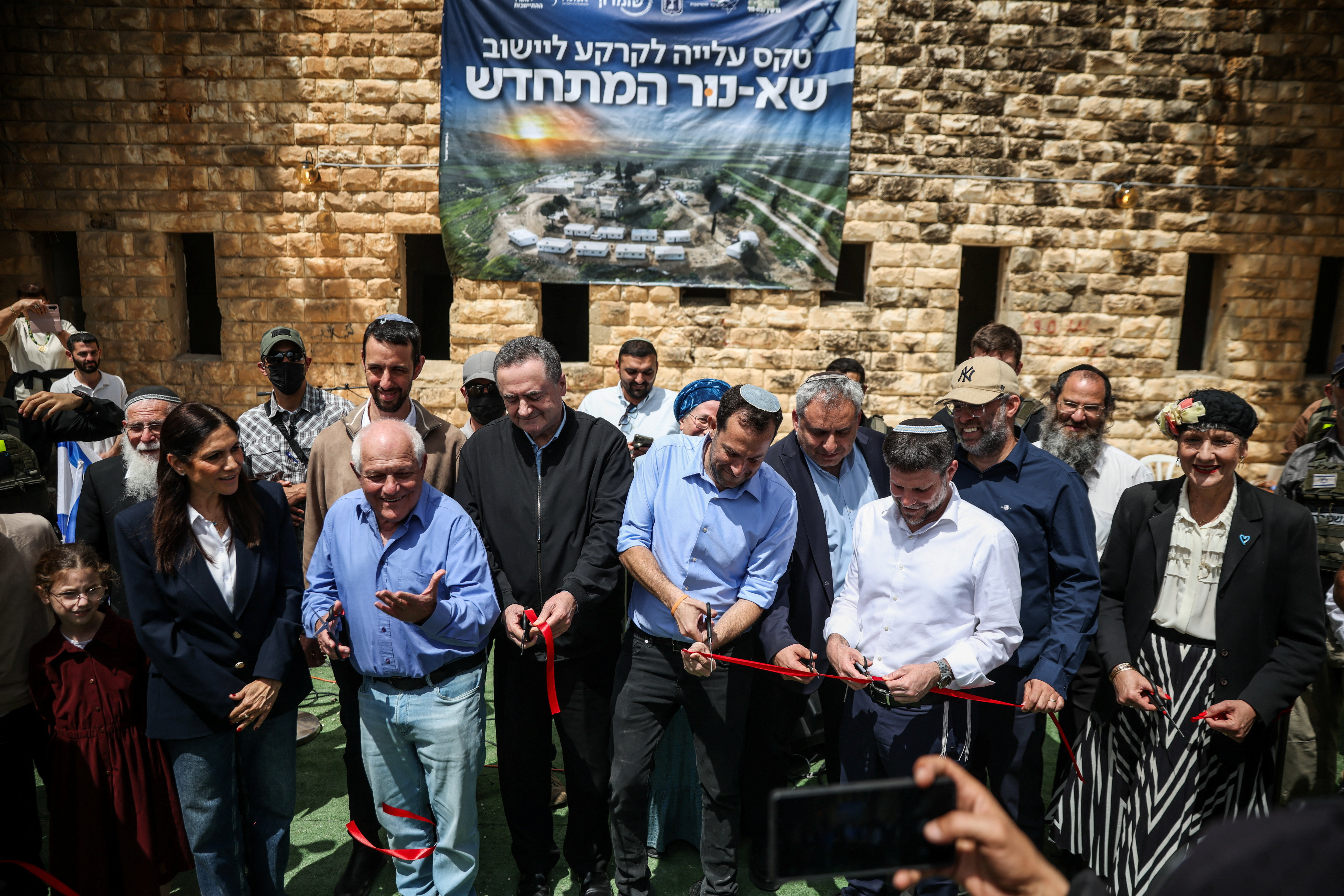 Israeli Defence Minister Israel Katz and Finance Minister Bezalel Smotrich attend a celebration for the re-establishment of the settlement of Sa-Nur, which was evacuated as part of Israel’s 2005 disengagement, in Sa-Nur, in the Israeli-occupied West Bank, April 19, 2026. REUTERS/Shir Torem