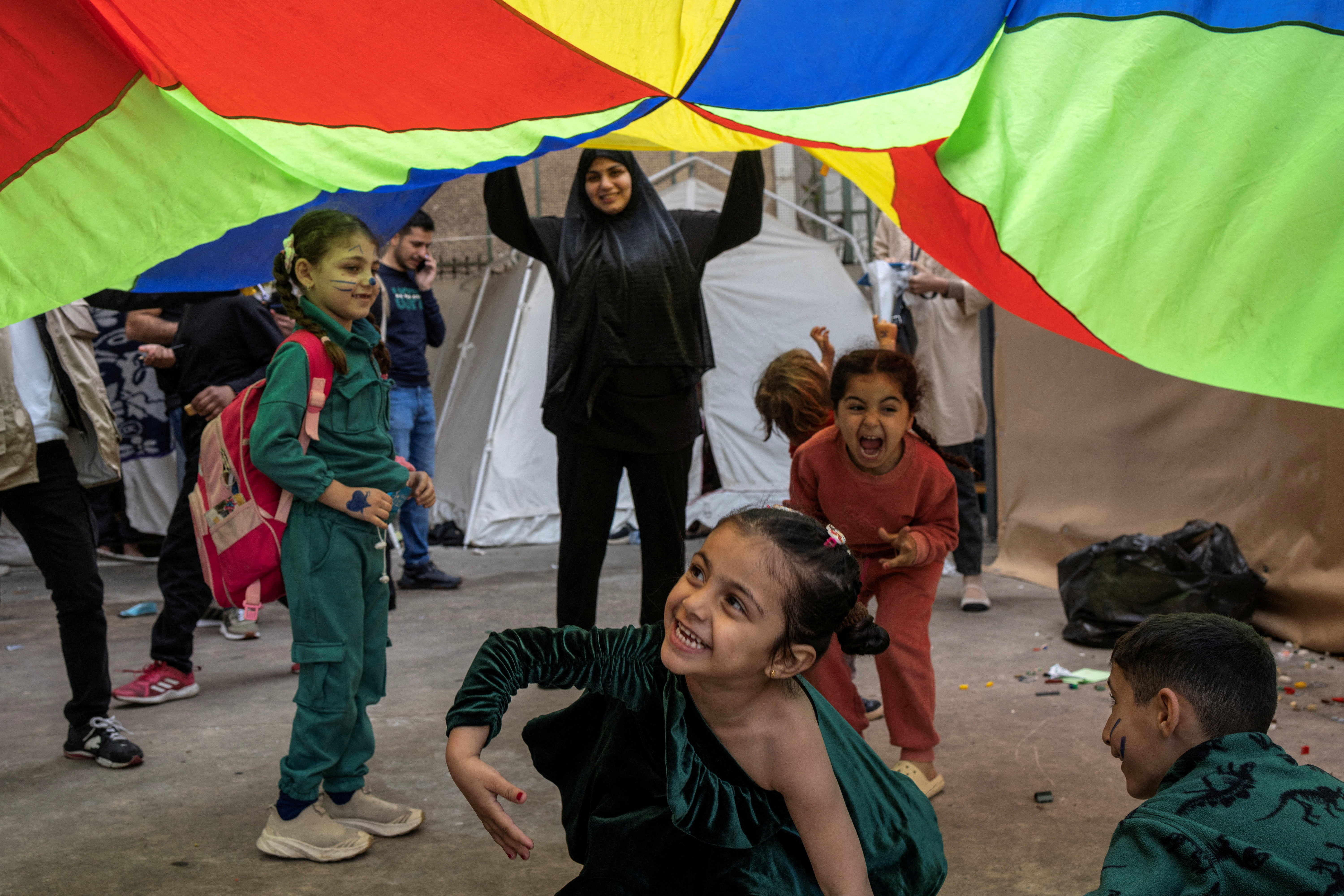 Children play in the yard of a school used as a temporary shelter for displaced people, in Beirut, Lebanon, April 24, 2026. REUTERS/Marko Djurica TPX IMAGES OF THE DAY