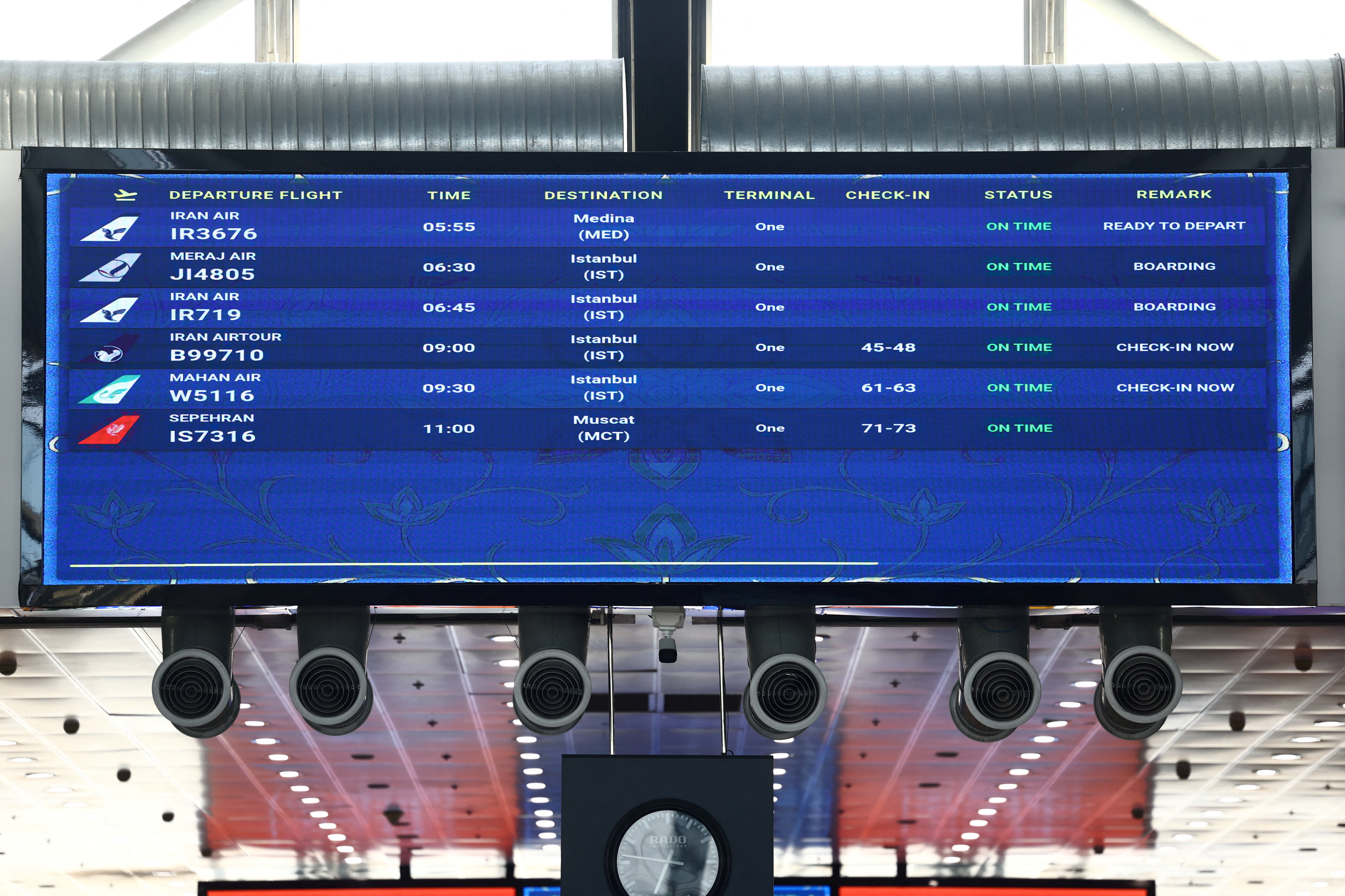 A flight board displays schedules after flights resumed at Tehran's airport