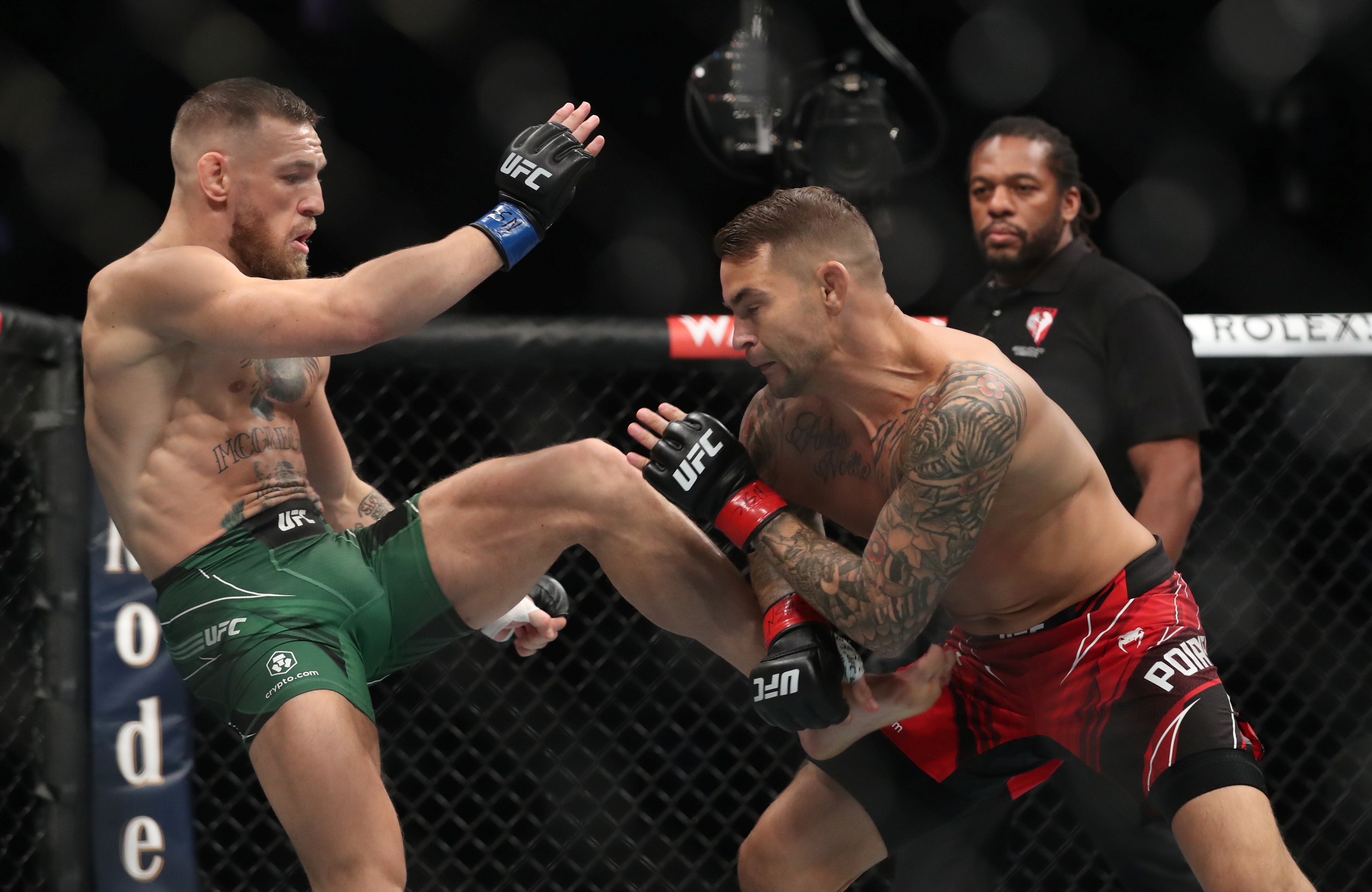 Dustin Poirier and Conor McGregor in action.