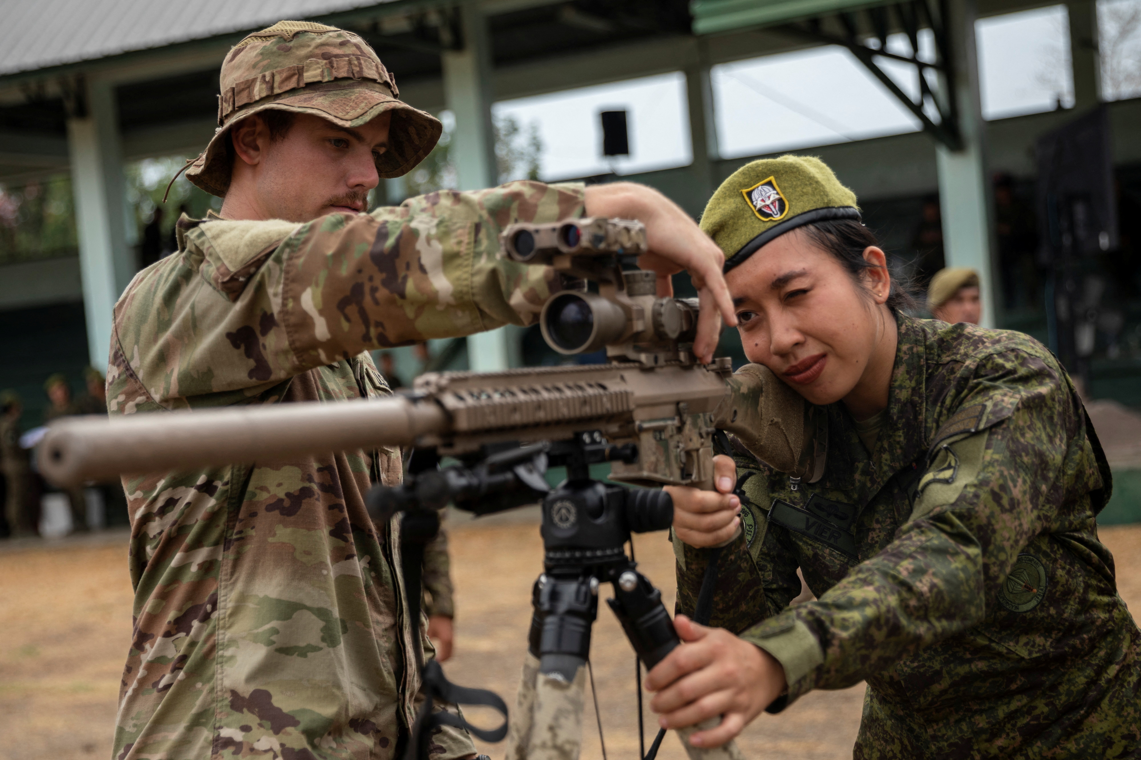 A Filipino soldier practises holding a weapon.