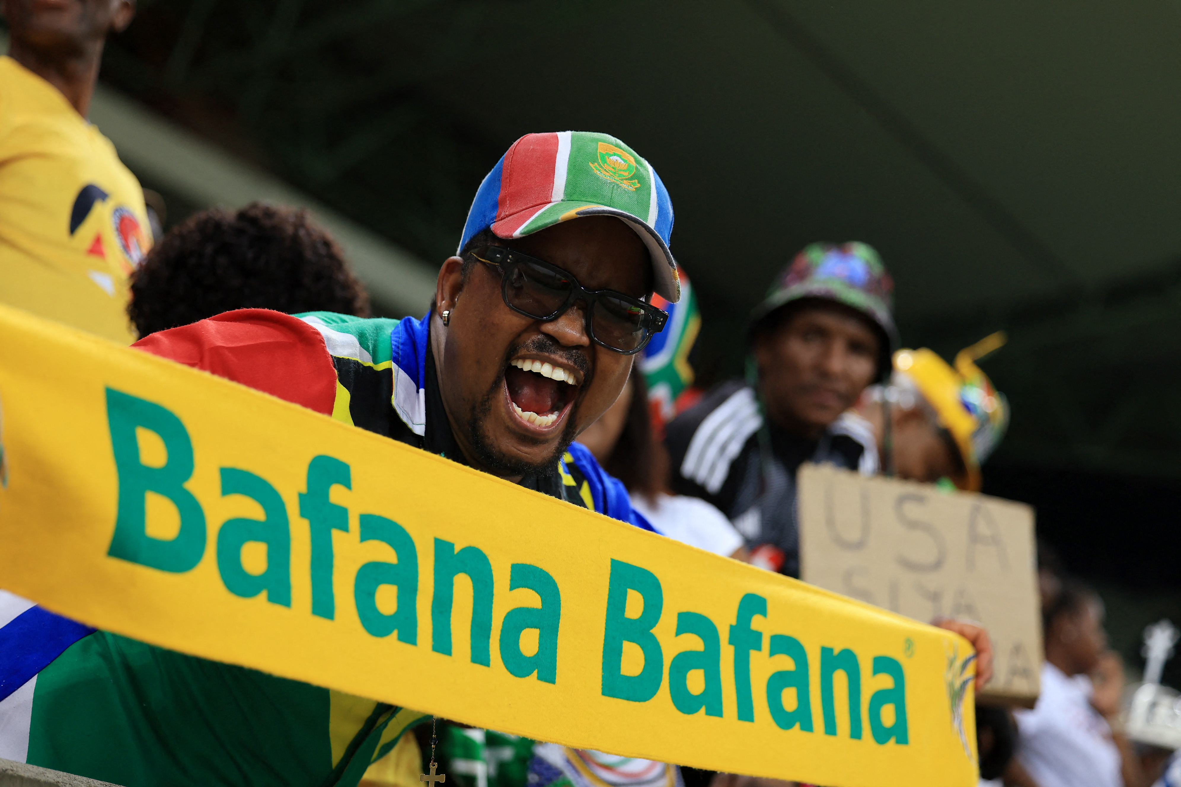 Soccer Football - FIFA World Cup - CAF Qualifiers - Group C - South Africa v Rwanda - Mbombela Stadium, Mbombela, South Africa - October 14, 2025 South Africa fans celebrate after qualifying for the FIFA World Cup REUTERS/Esa Alexander