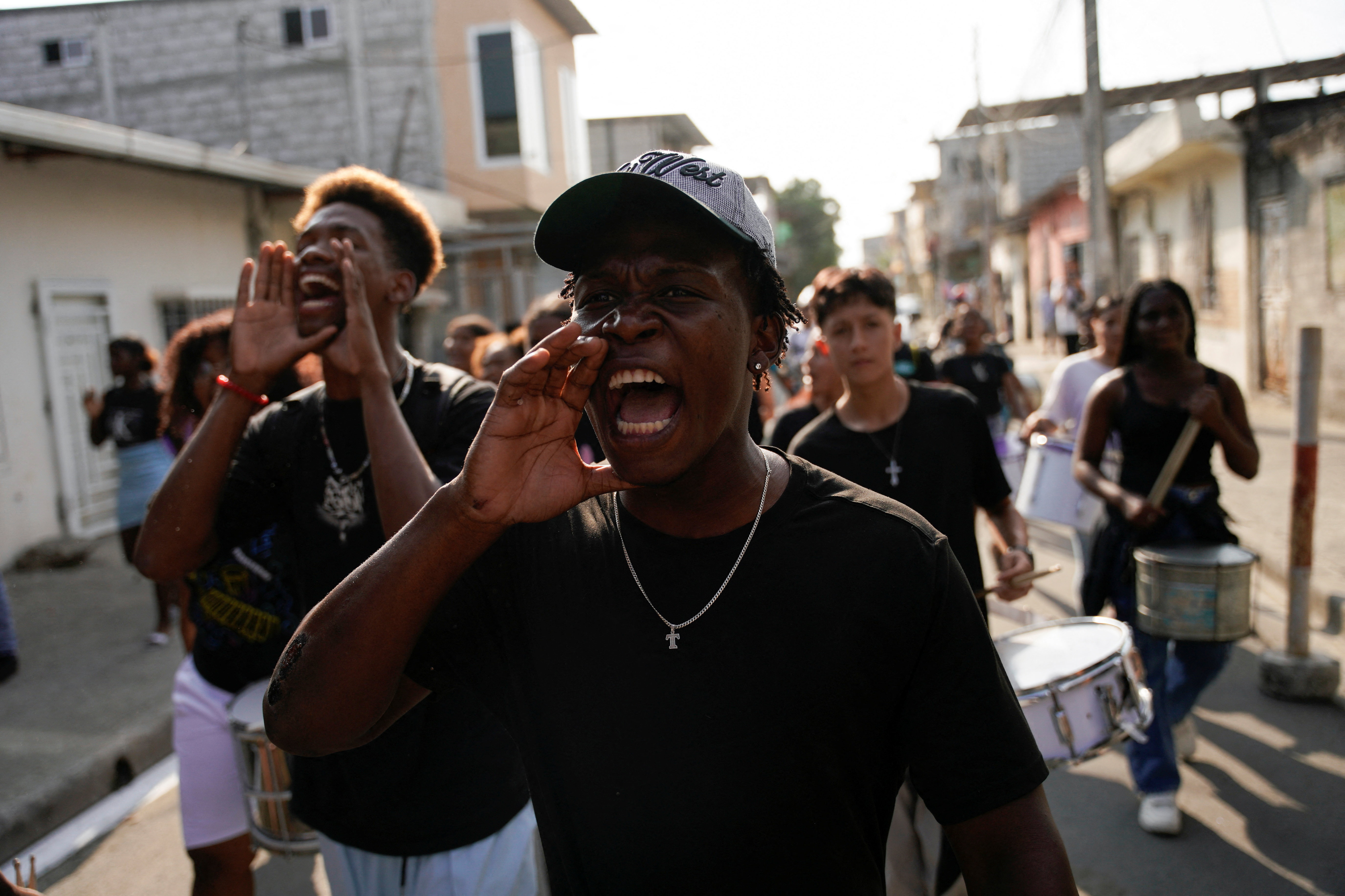 Family members and supporters march on the one-year anniversary of the disappearance of four boys who were later found dead, in the Las Malvinas neighbourhood in Guayaquil, Ecuador, December 8, 2025. [Santiago Arcos/Reuters]
