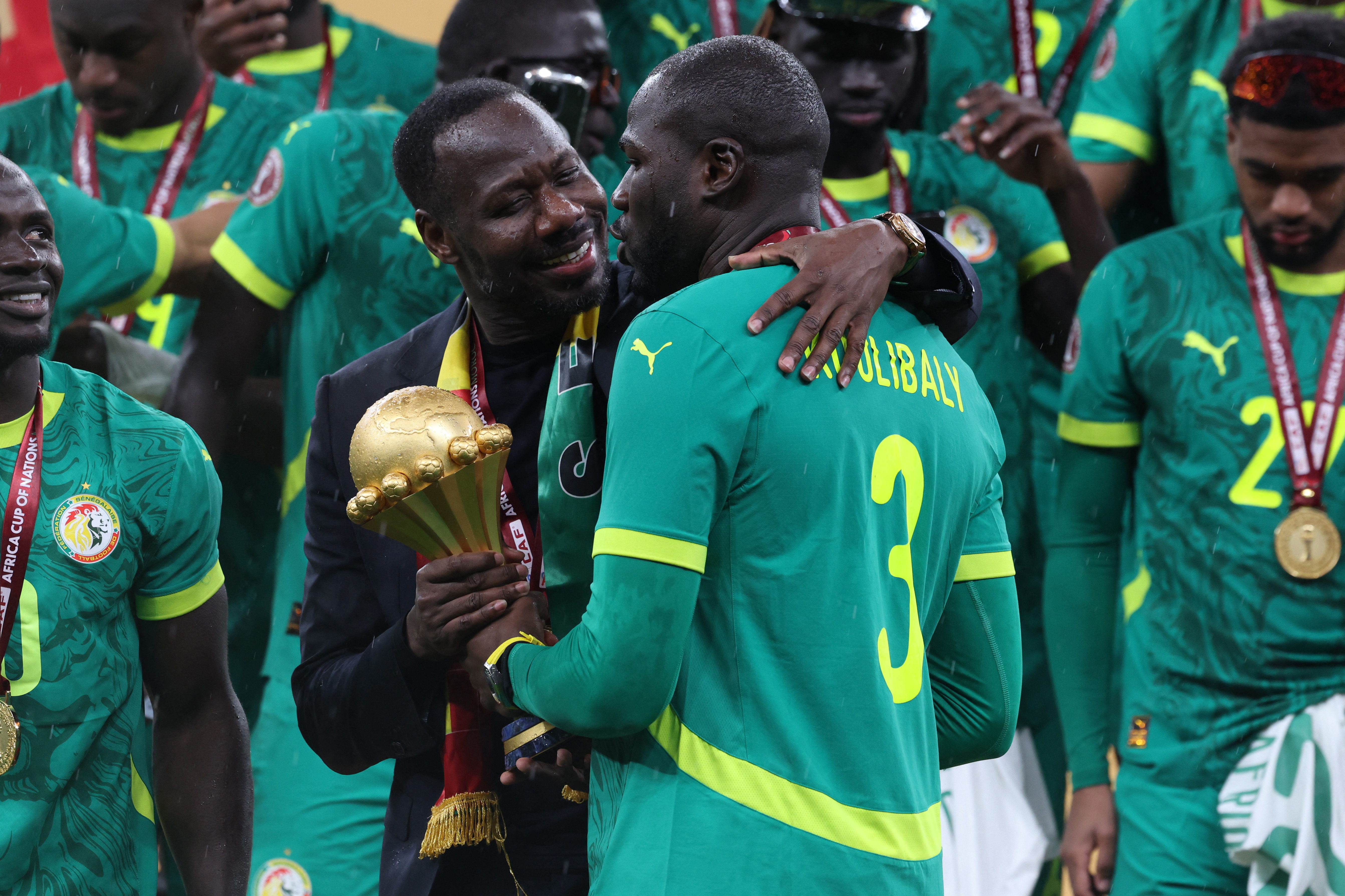 Senegal coach Pape Thiaw and Kalidou Koulibaly celebrate with the trophy after winning the Africa Cup of Nations