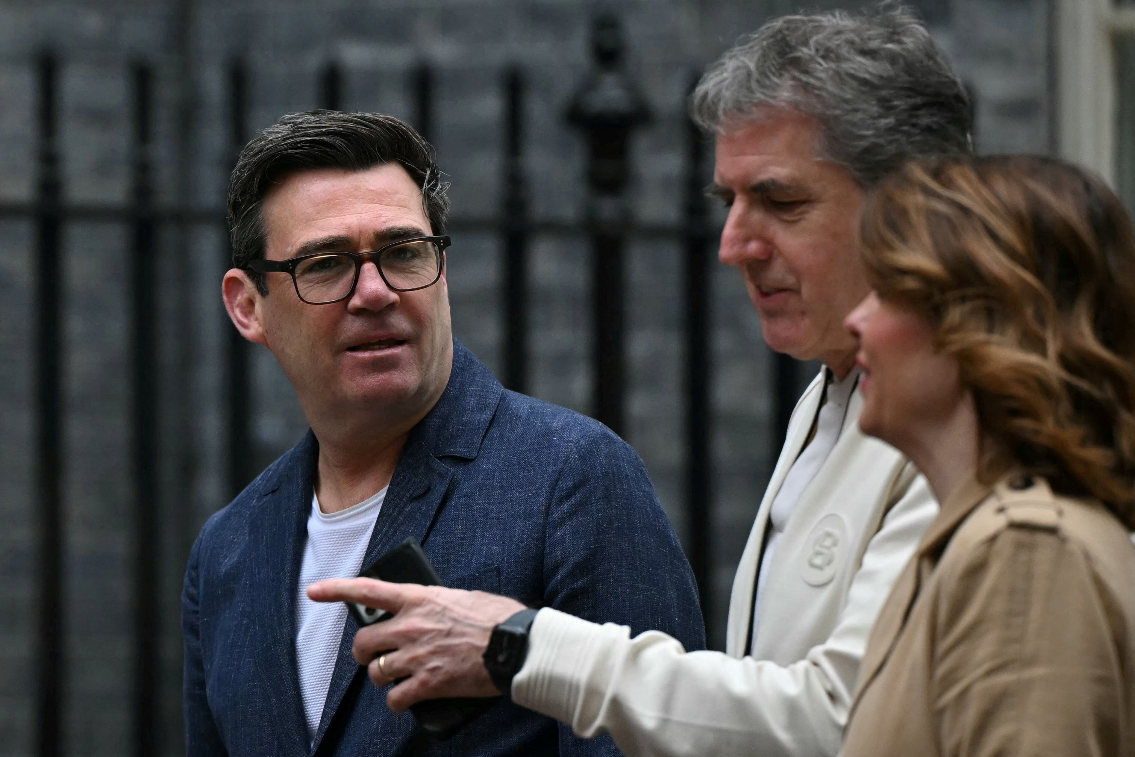 Greater Manchester Mayor Andy Burnham walks with Steve Rotheram, Mayor of Liverpool City Region, as they arrive at Downing Street in central London, Britain March 31, 2026. JUSTIN TALLIS/Pool via REUTERS