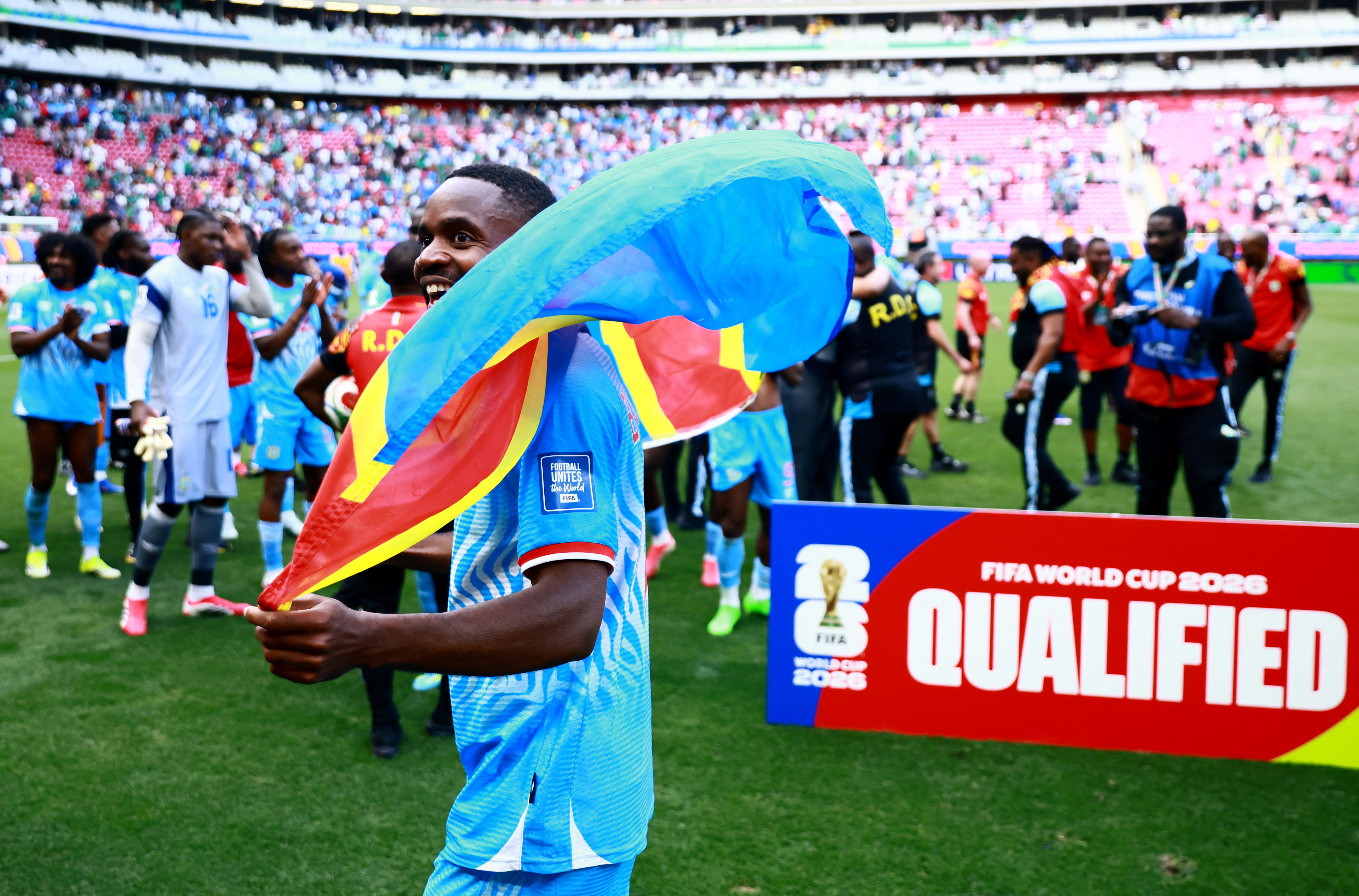 DR Congo's Cedric Bakambu celebrates qualifying for the FIFA World Cup.