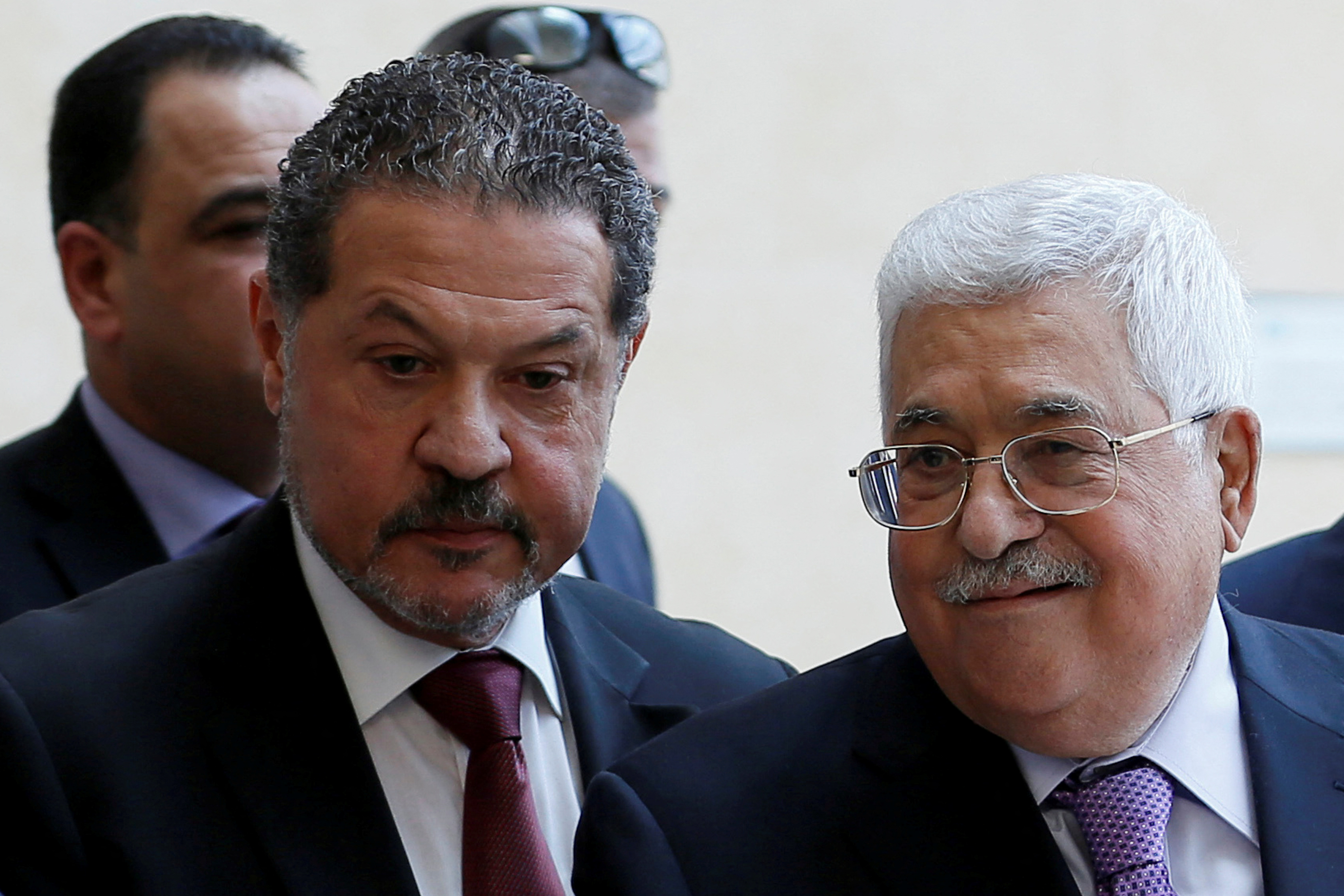 Palestinian president Mahmoud Abbas, accompanied by his son Yasser, leaves a hospital in Ramallah in the Israeli-occupied West Bank on May 28, 2018.
