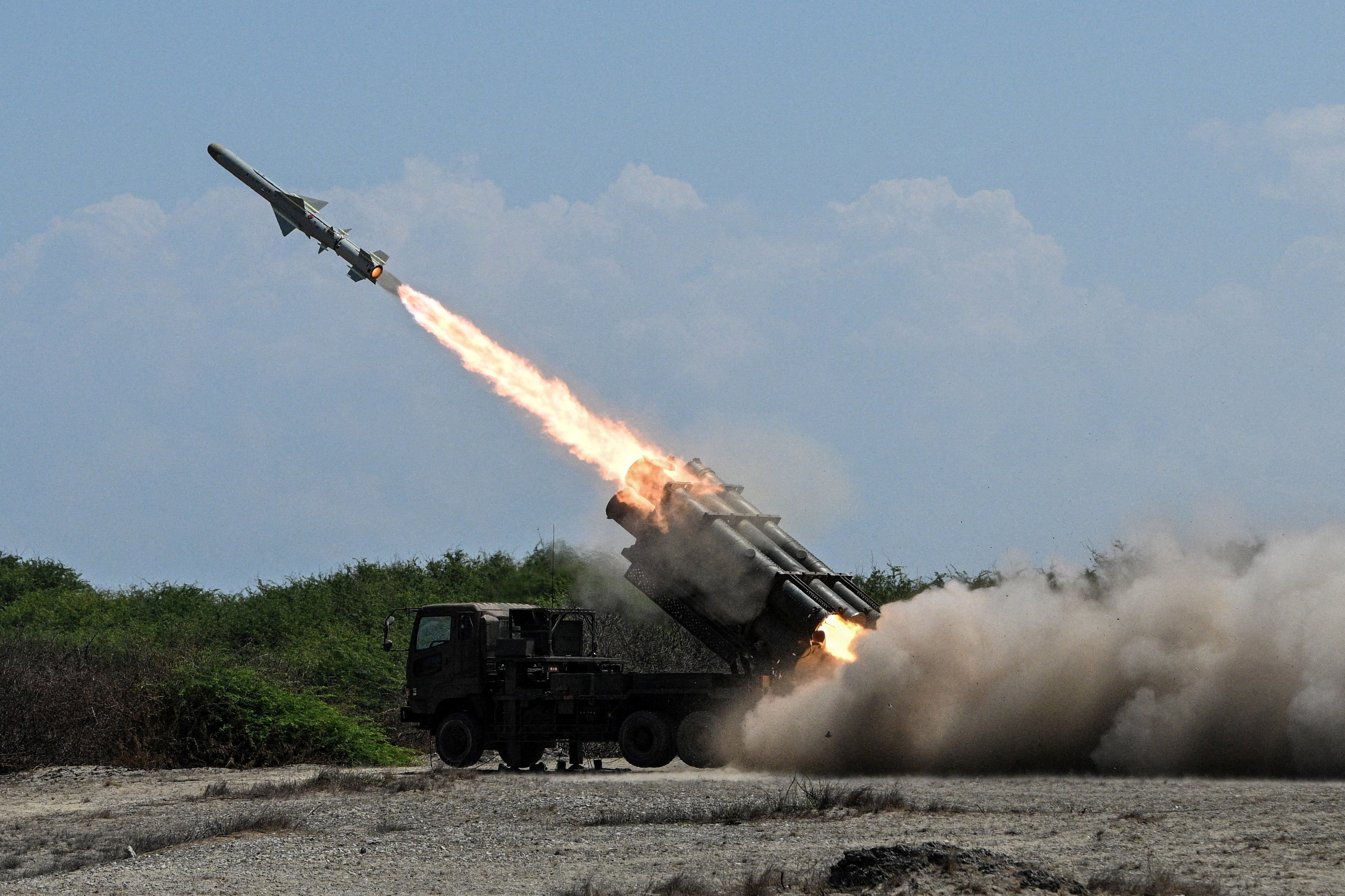 A Japan Ground Self-Defense Force (JGSDF) Type 88 surface-to-ship missile launcher fires during the Joint Task Force (JTF) Maritime Strike, part of Balikatan, the annual joint military exercises between the United States and the Philippines, at Culili Point Sand Dunes, Paoay, Ilocos Norte province, Philippines, May 6, 2026. REUTERS/Noel Celis TPX IMAGES OF THE DAY
