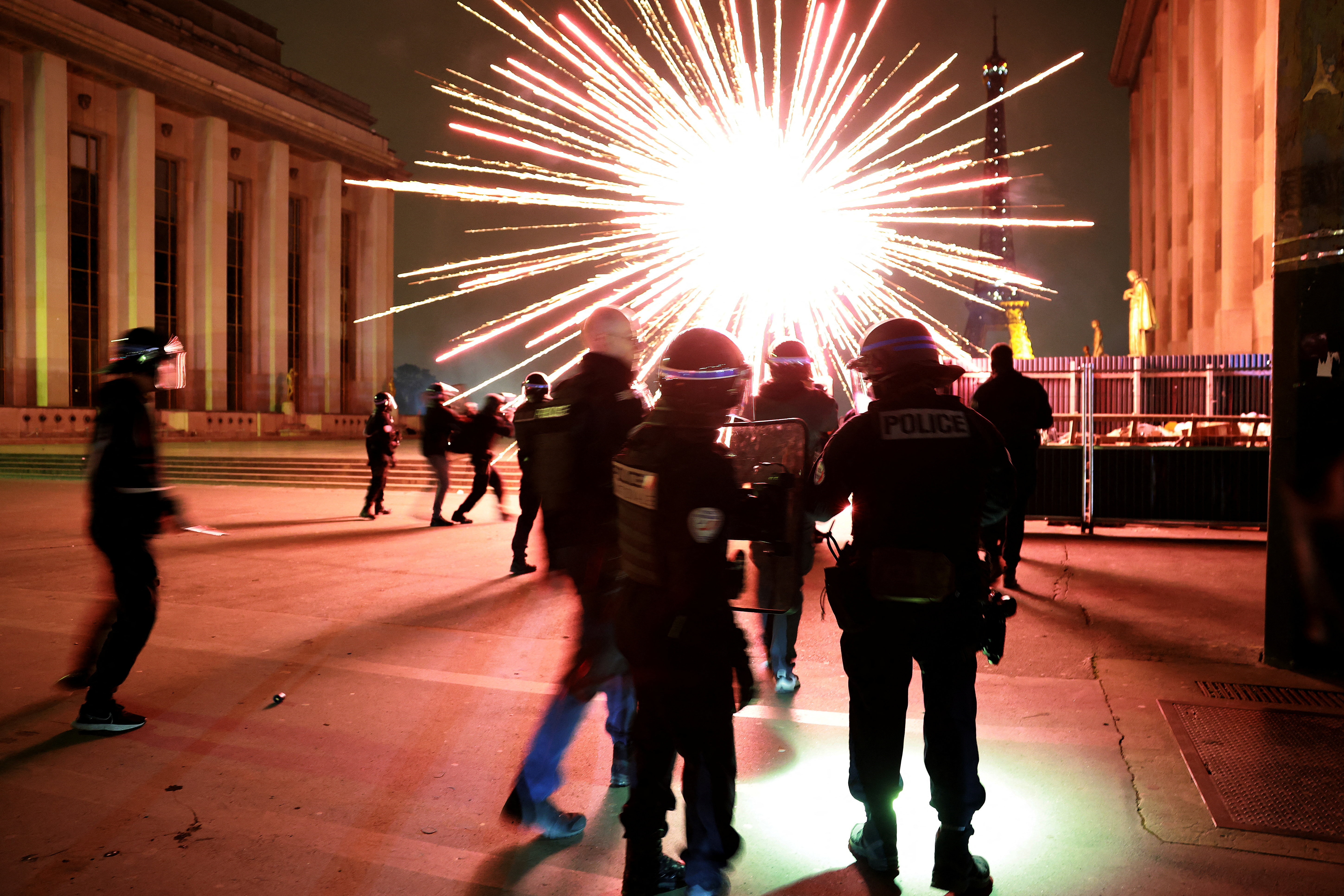 Riot police near the Eiffel Tower after Paris St Germain won the Champions League semi final match against Bayern Munich