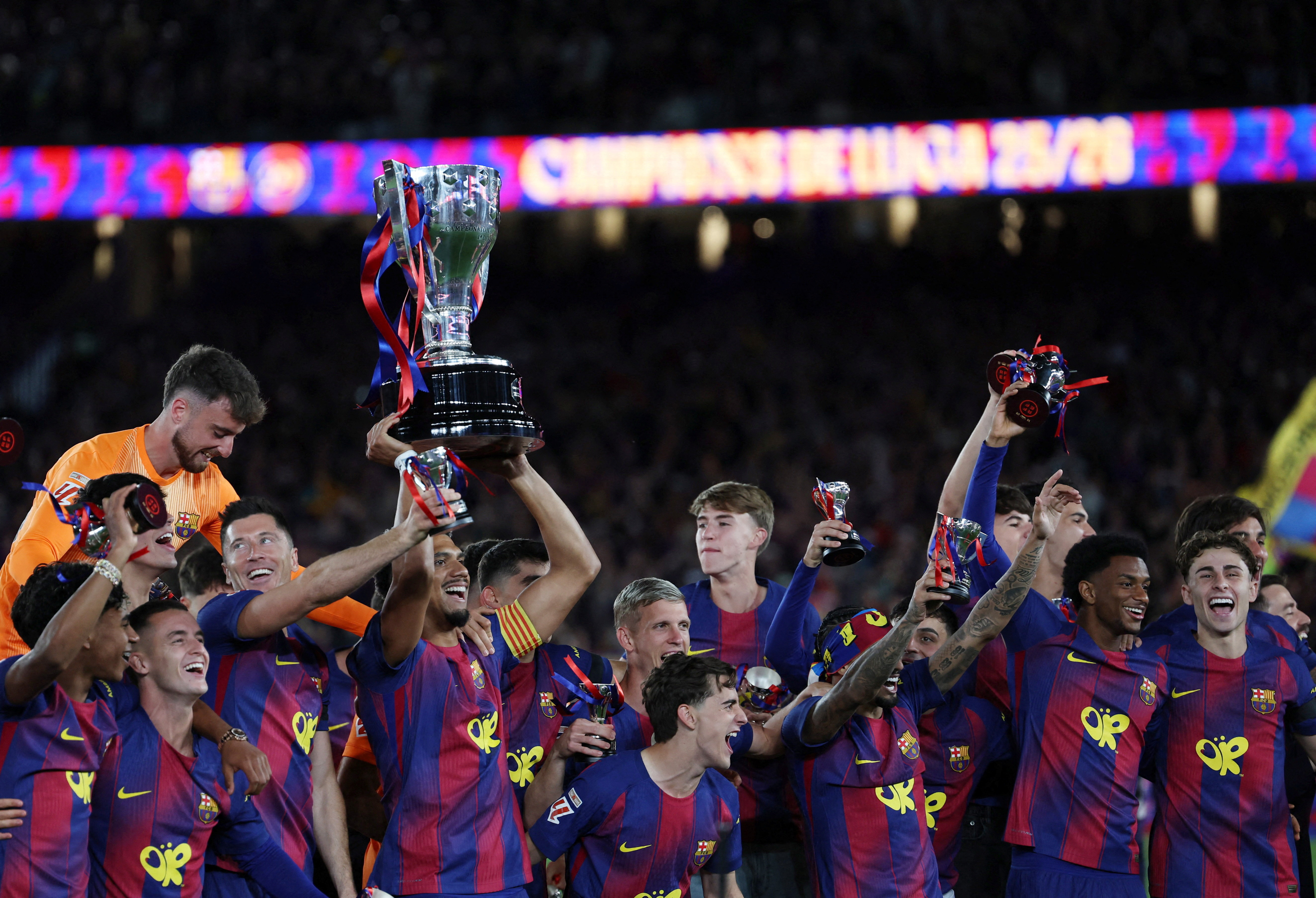 Barcelona’s players celebrate at the Camp Nou stadium after winning their second La Liga title in a row