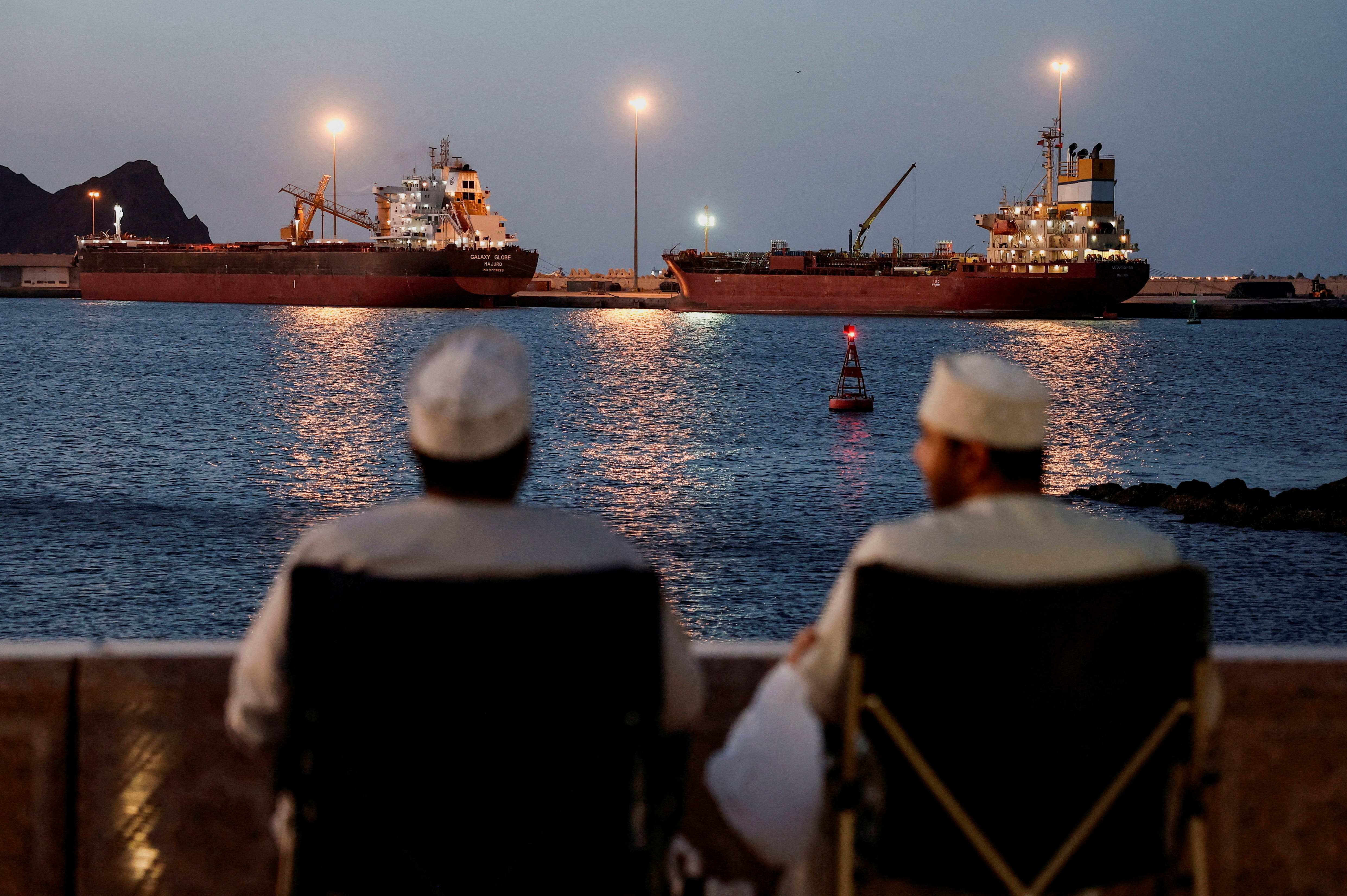 The Galaxy Globe bulk carrier and the Luojiashan tanker sit anchored as Iran vows to close the Strait of Hormuz,