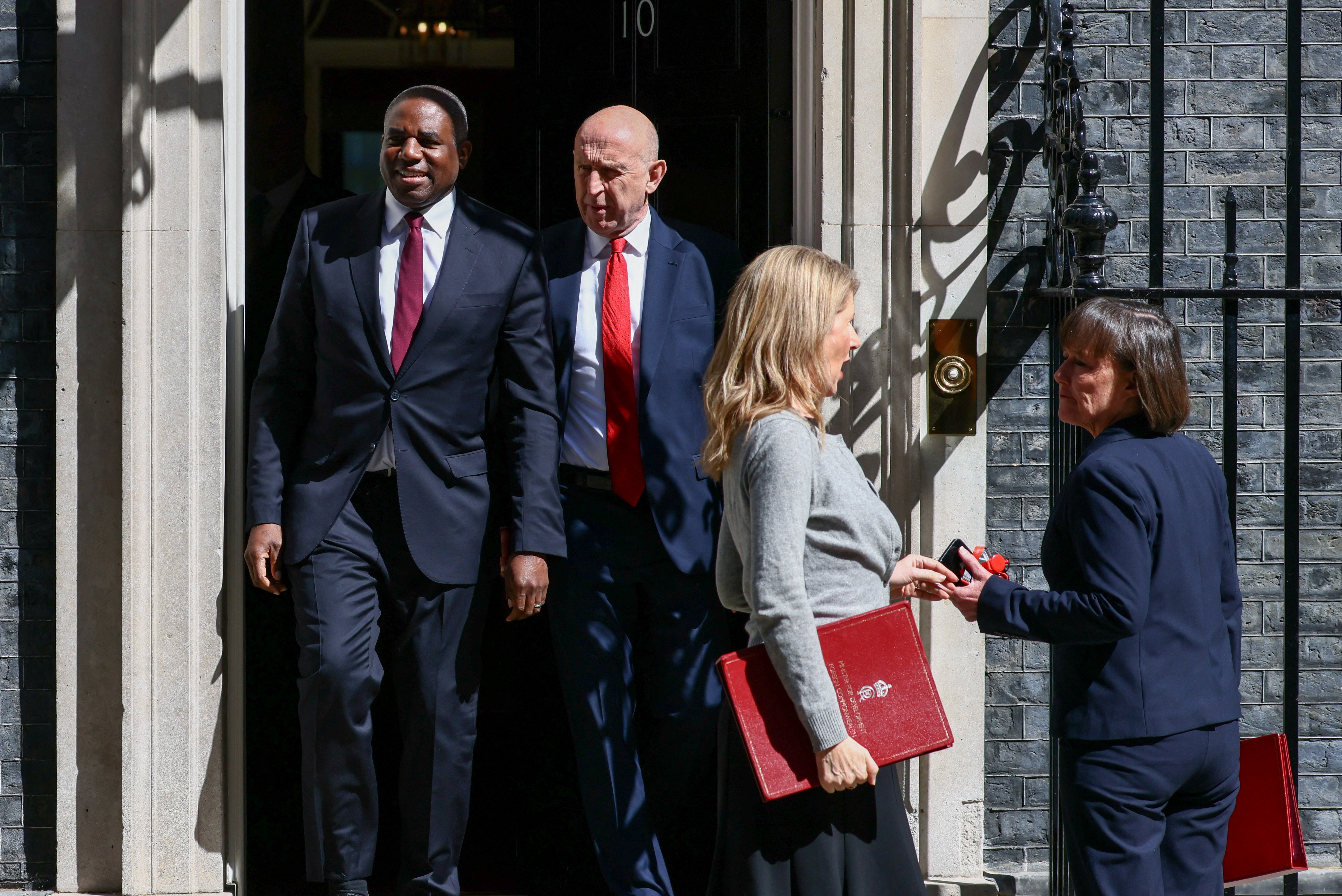 British Deputy Prime Minister and Justice Secretary David Lammy, Defence Secretary John Healey, Minister of State for International Development and Africa Jenny Chapman and Secretary of State for Wales Jo Stevens outside No. 10 Downing Street after attending a cabinet meeting, the day before the State Opening of Parliament, in London, Britain, May 12, 2026. REUTERS/Jack Taylor
