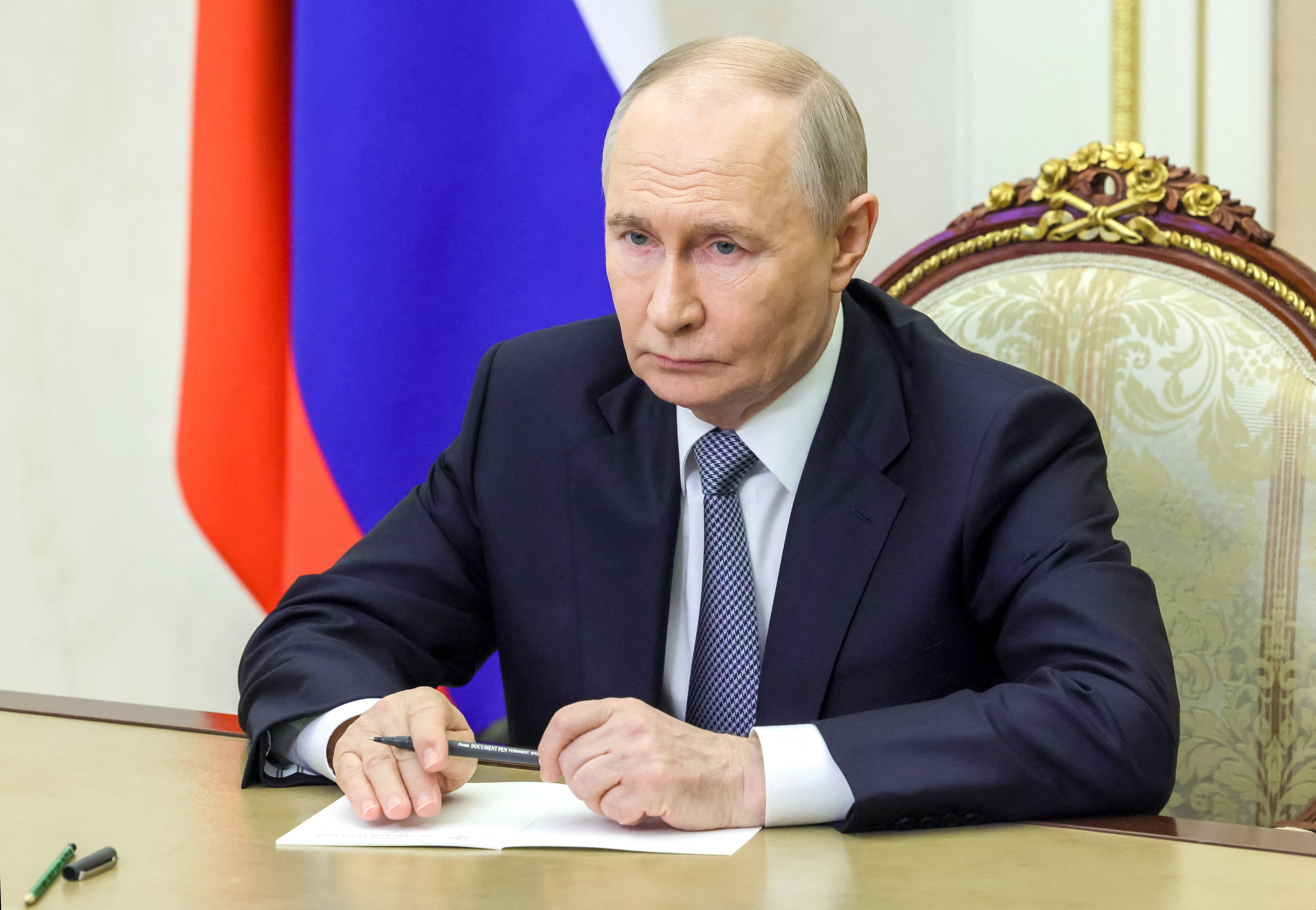 Russian President Vladimir Putin attends a meeting with Commander of the Russian Strategic Missile Forces Colonel General Sergei Karakayev via video link at the Kremlin in Moscow, Russia May 12, 2026.