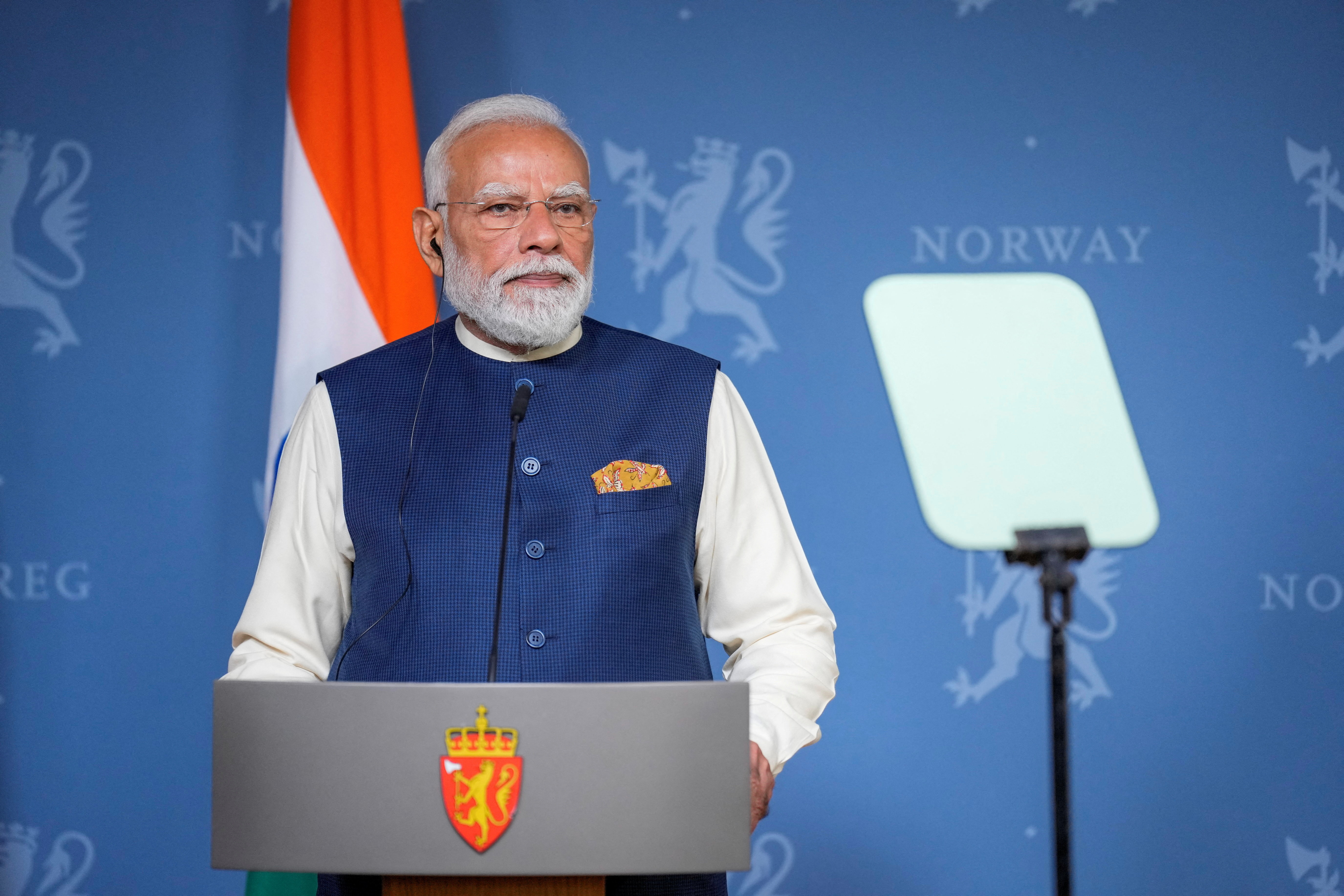 Indian Prime Minister Narendra Modi speaks at a podium.