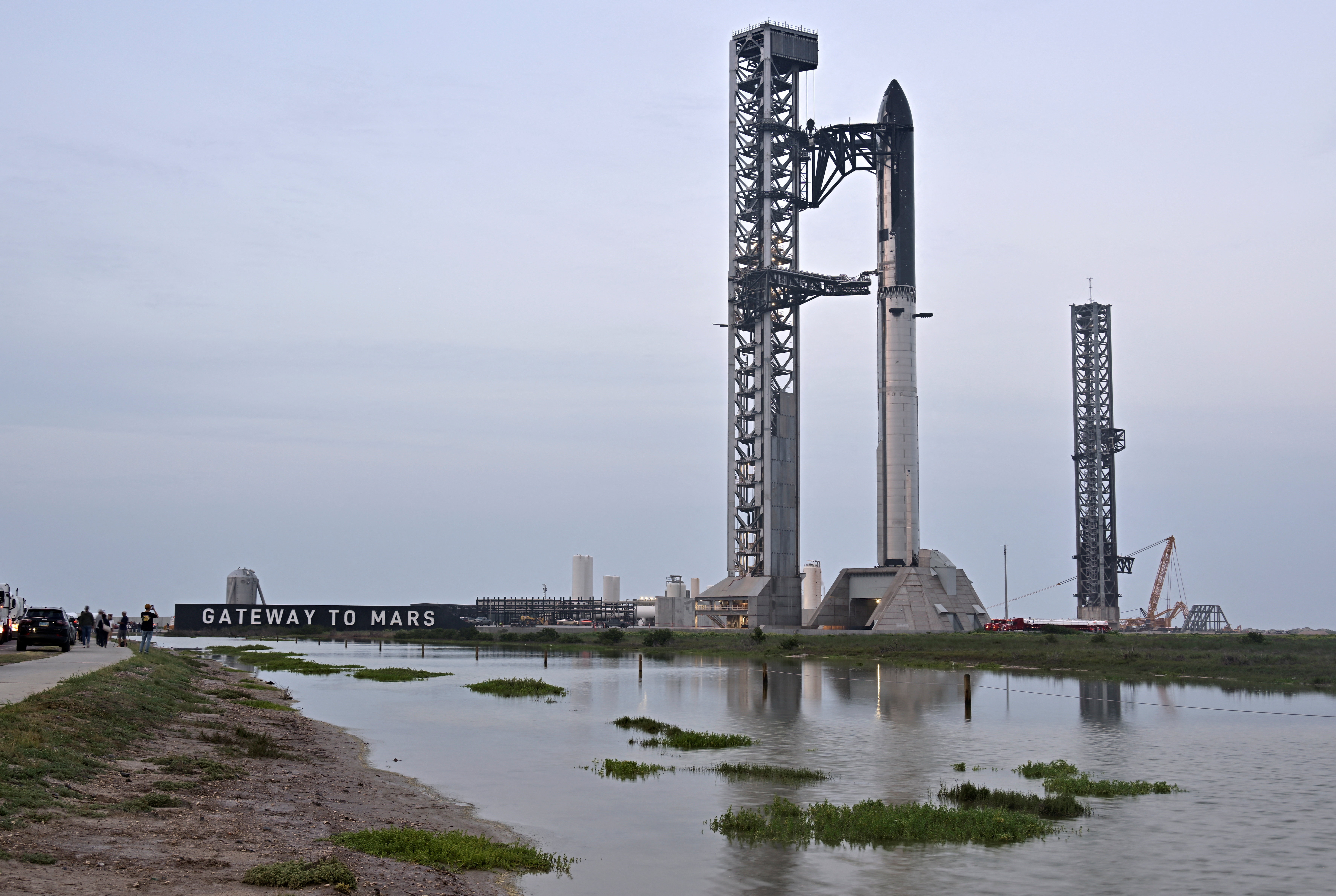 The SpaceX Starship spacecraft sits atop the Super Heavy Booster as preparations continue for the 12th test flight of the Starship spacecraft in Starbase, Texas, U.S., May 20, 2026. REUTERS/Steve Nesius