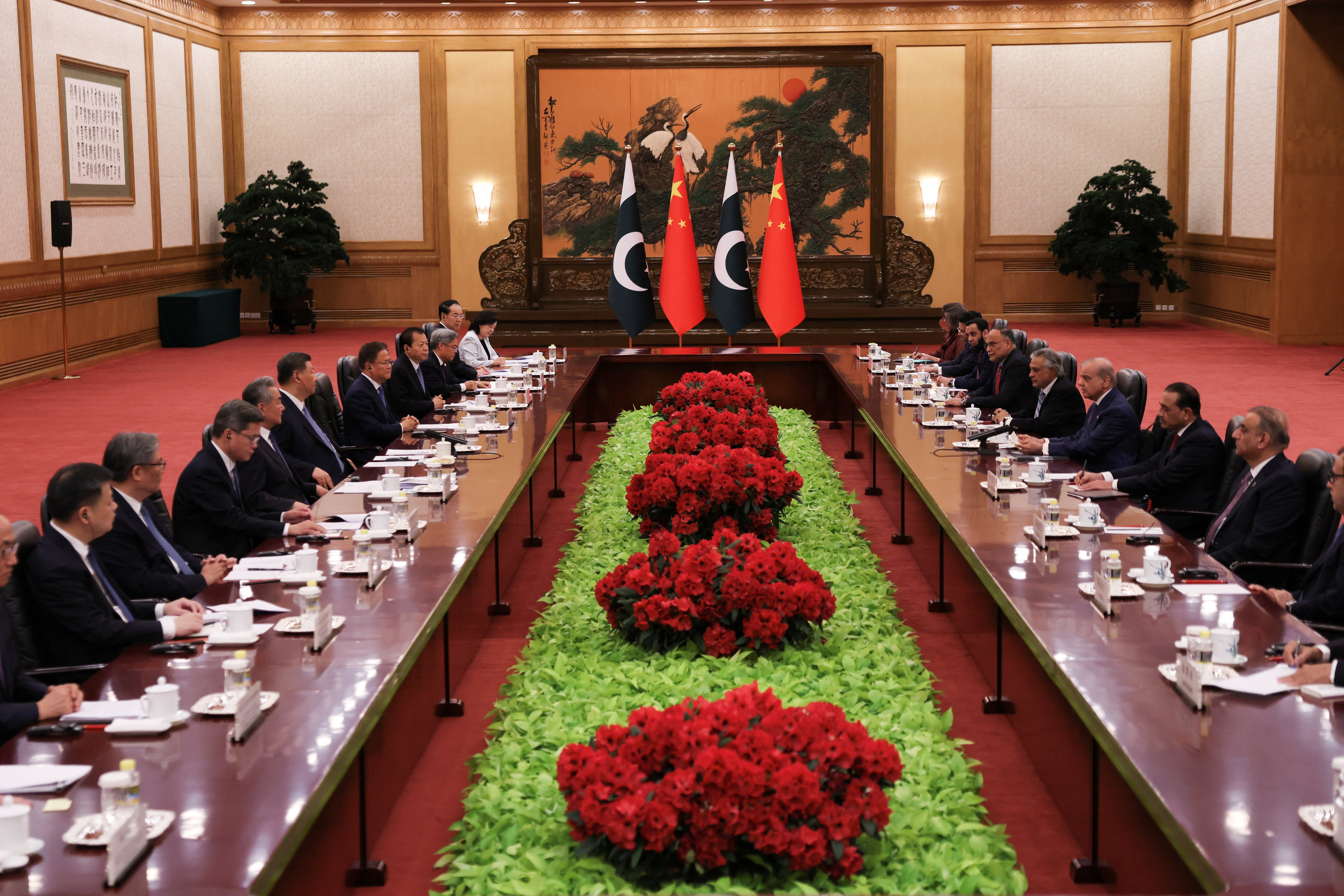Chinese President Xi Jinping and Pakistan's Prime Minister Shehbaz Sharif attend a meeting in Beijing