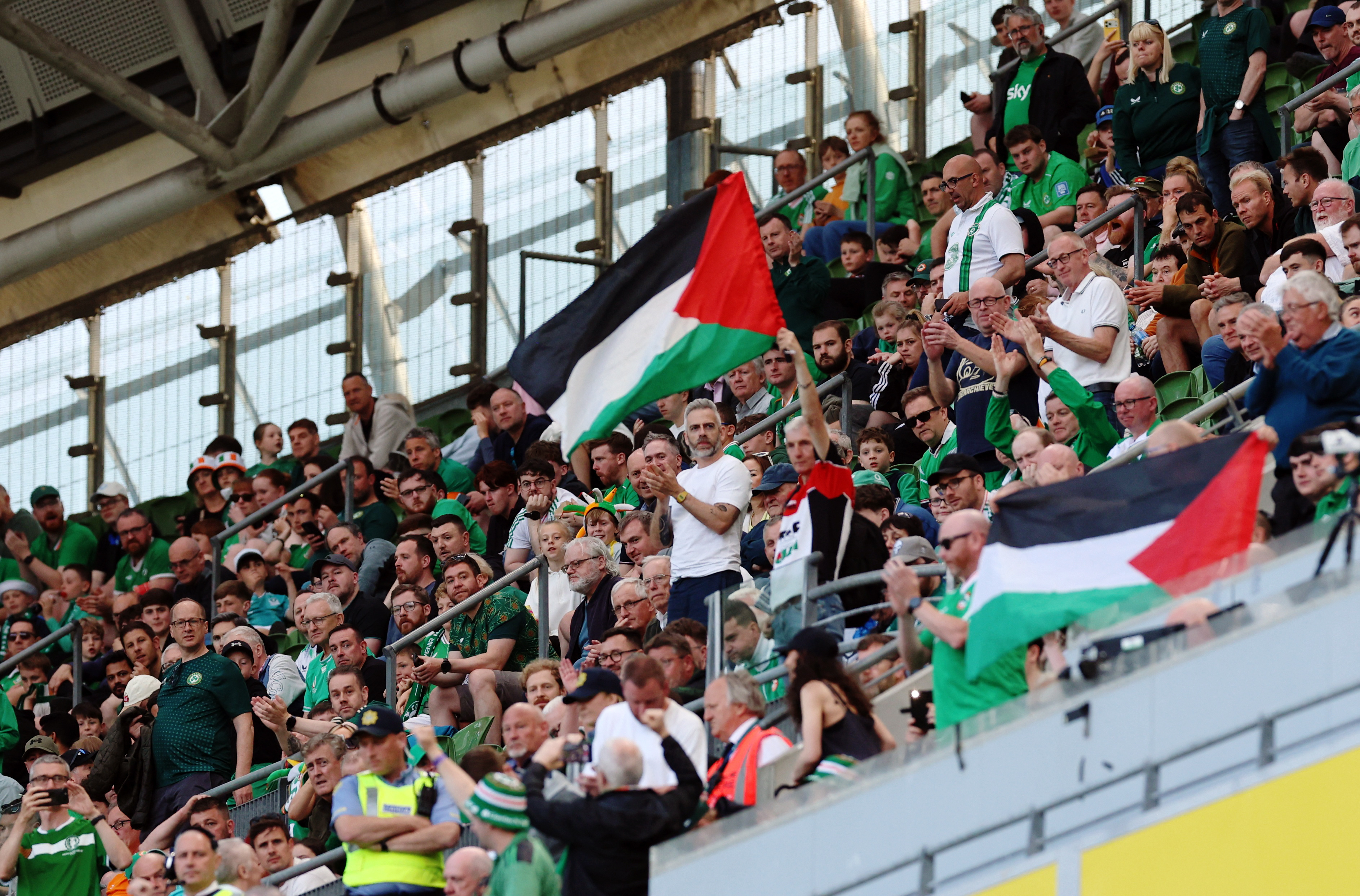 Palestine flags are displayed in the stands as part of a protest during the Ireland-Qatar match
