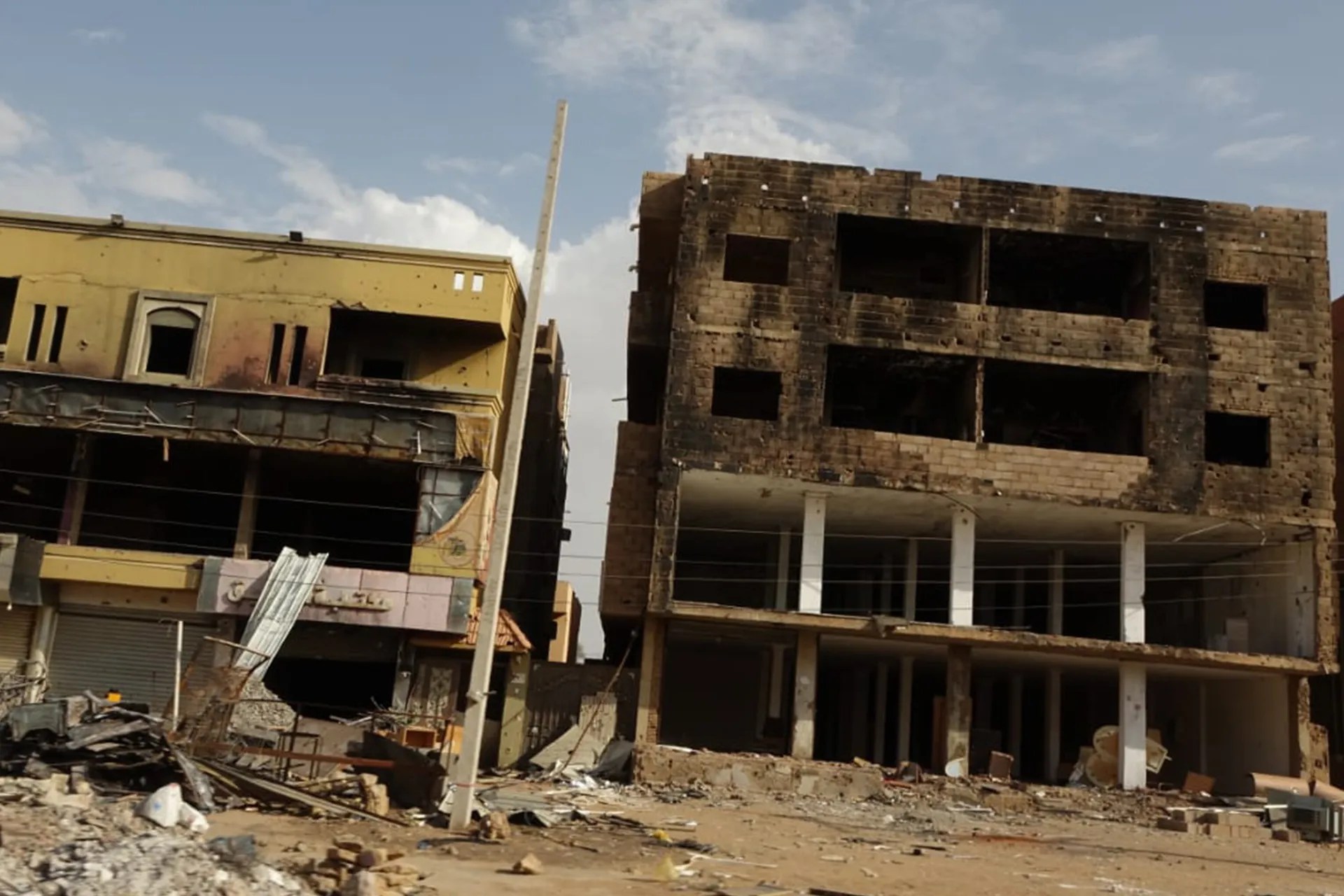 The war has destroyed and damaged many buildings in central Khartoum [Al Jazeera]