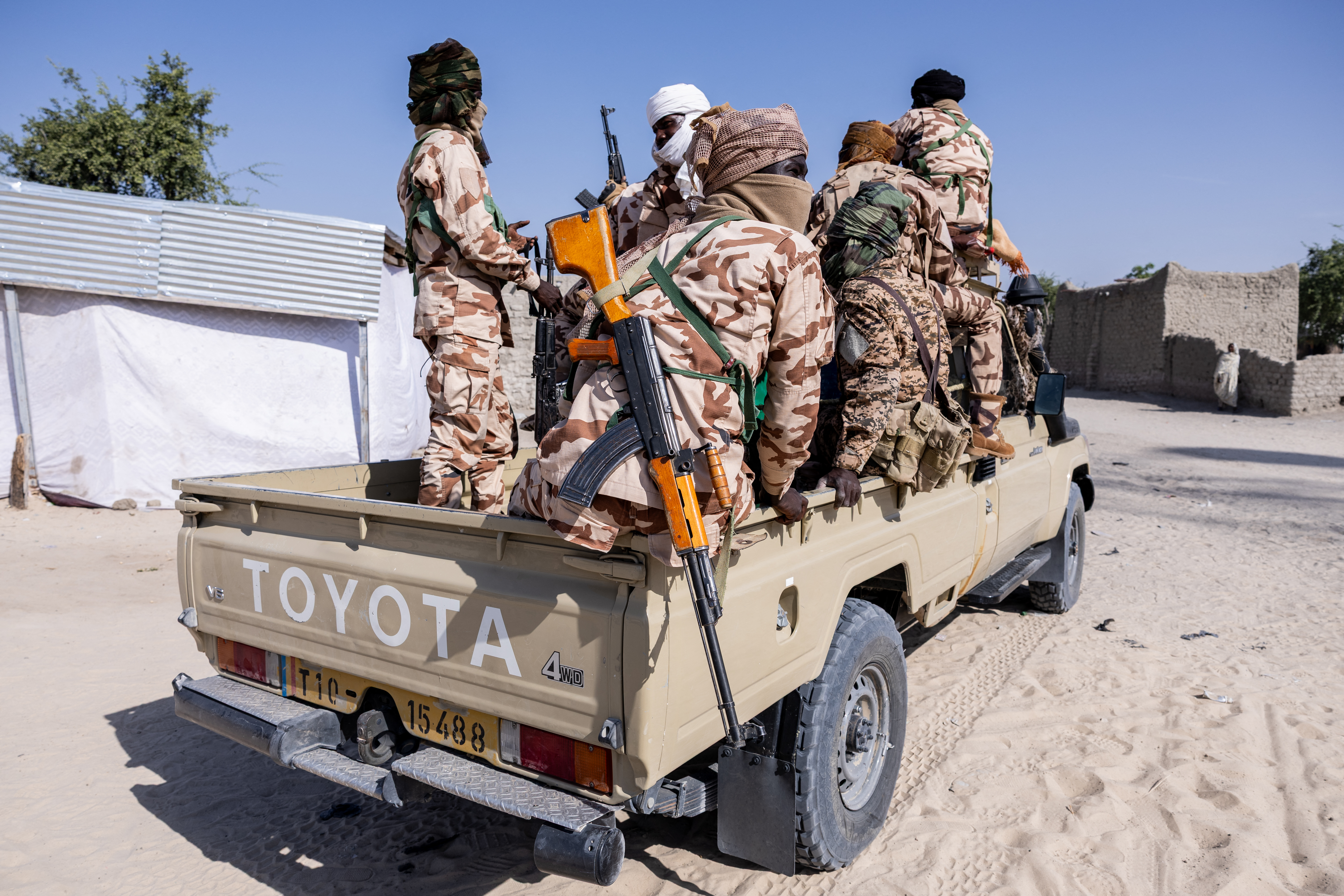 Chadian soldiers from the anti-terrorist unit travel in the back of a vehicle.