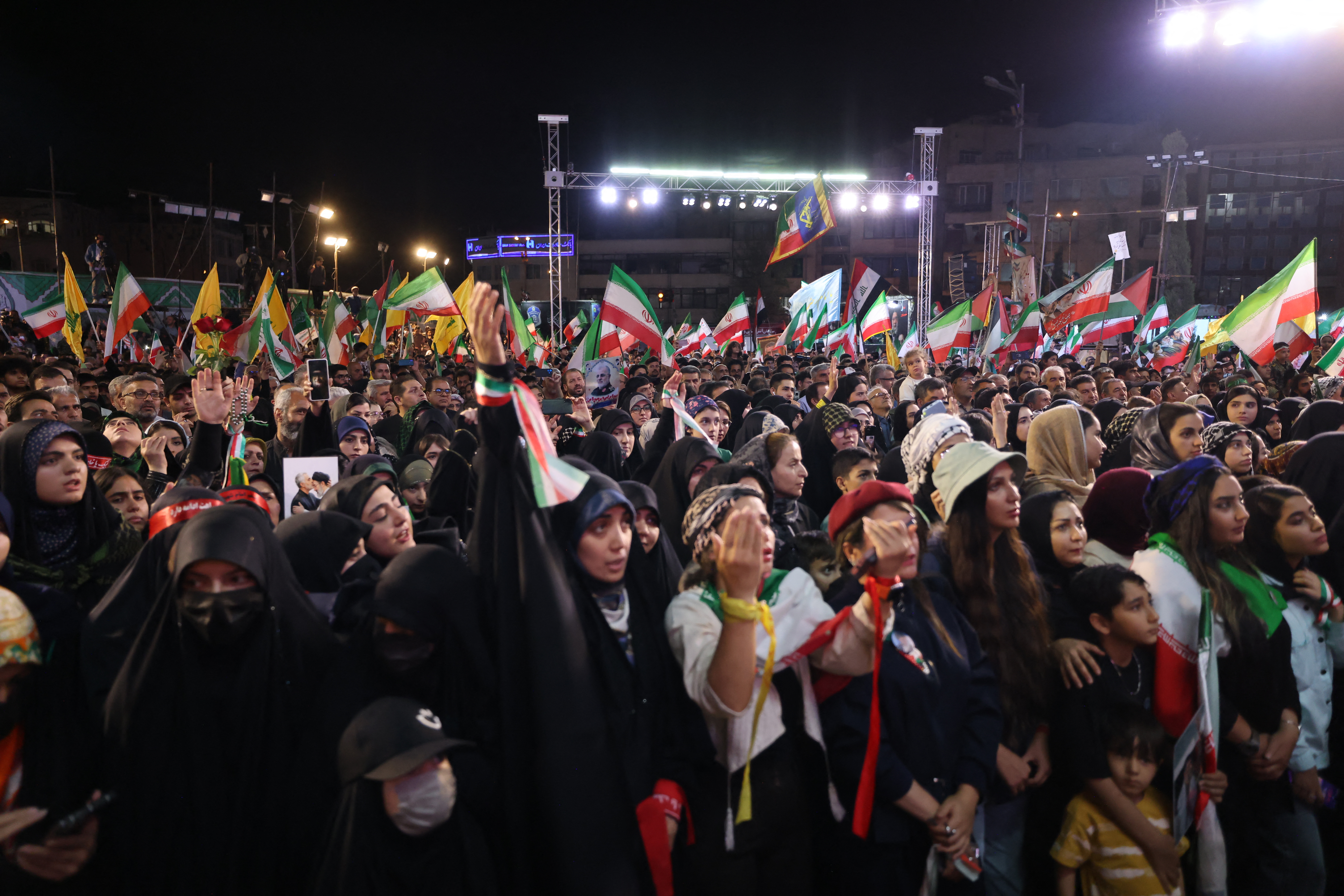 People gather to attend the farewell ceremony of Iran's national football team ahead of their departure for the 2026 FIFA World Cup, in Tehran on May 13, 2026. The president of the Iranian Football Federation said late May 9 that if Iran dropped out of the World Cup, it would deprive the country of a "major diplomatic asset". World football's governing body FIFA has insisted for weeks that Iran will take part. Iran, who are due to be based in Tucson, Arizona, during the World Cup, face New Zealand, Belgium and Egypt in Group G. The Iranians open their World Cup campaign against New Zealand in Los Angeles on June 15. (Photo by ATTA KENARE / AFP) /
