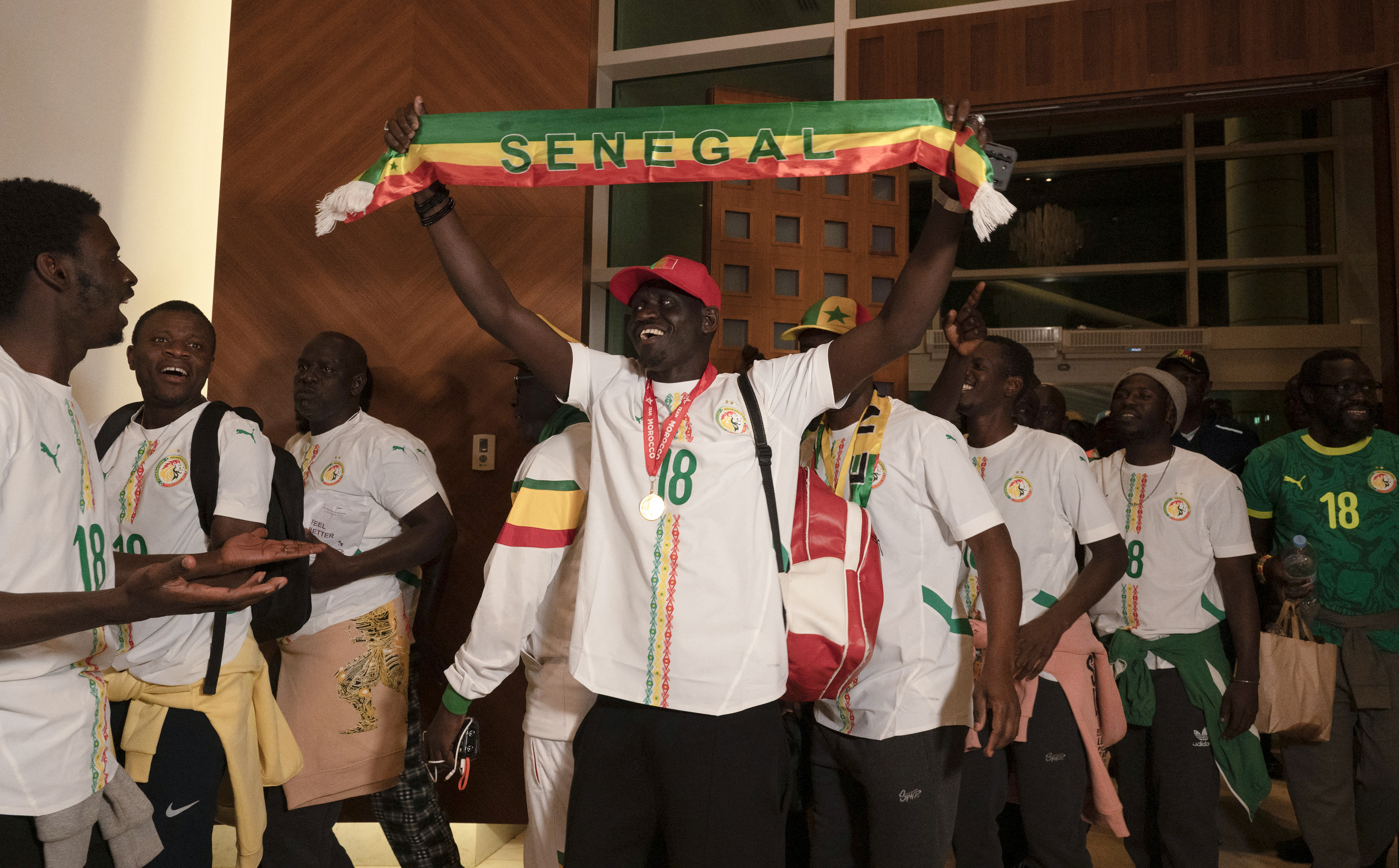 Senegalese supporters who were granted a royal pardon in Morocco arrive at Blaise Diagne airport in Ndiass, Senegal