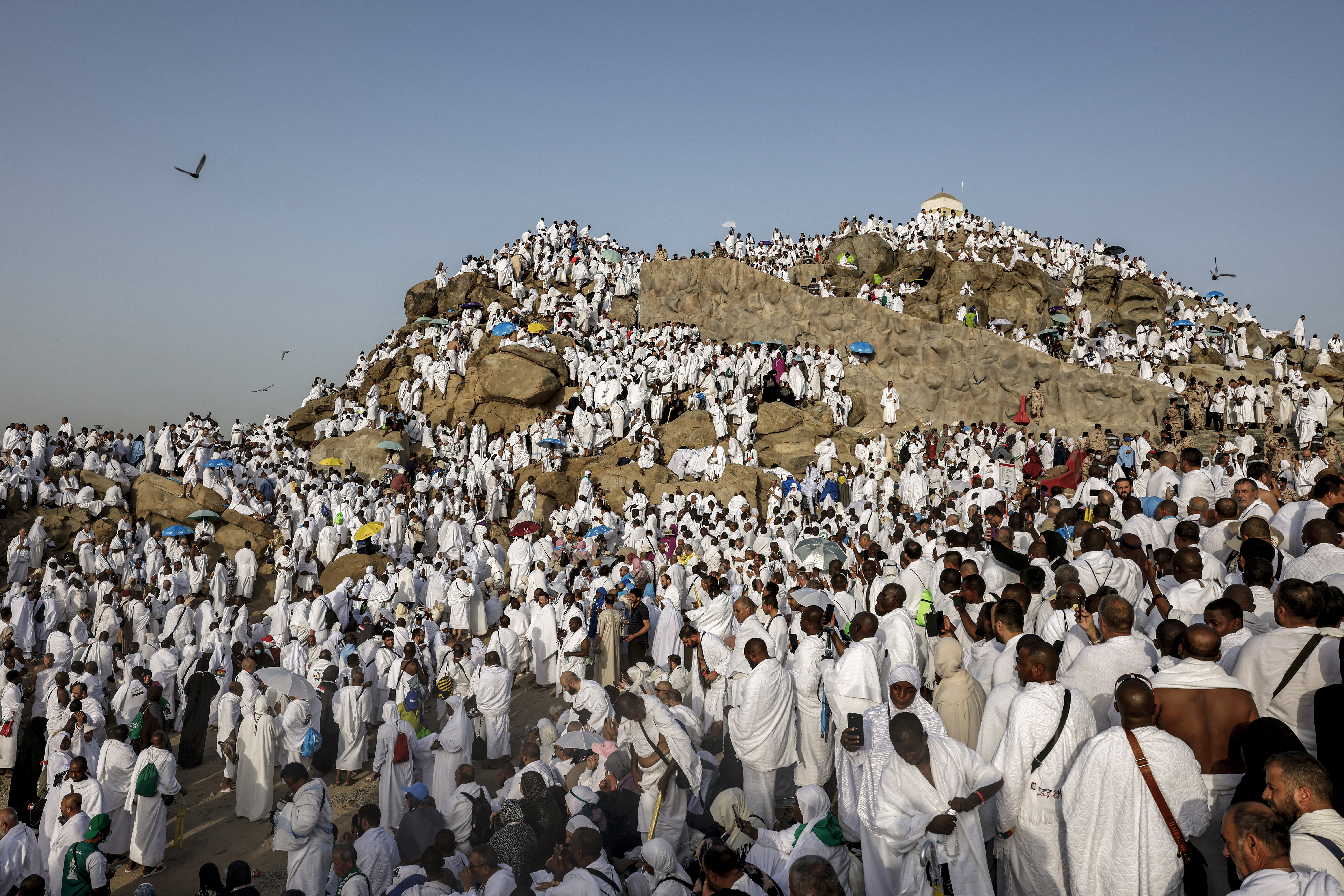 Hajj pilgrims gather at Mount Arafat under scorching desert sun