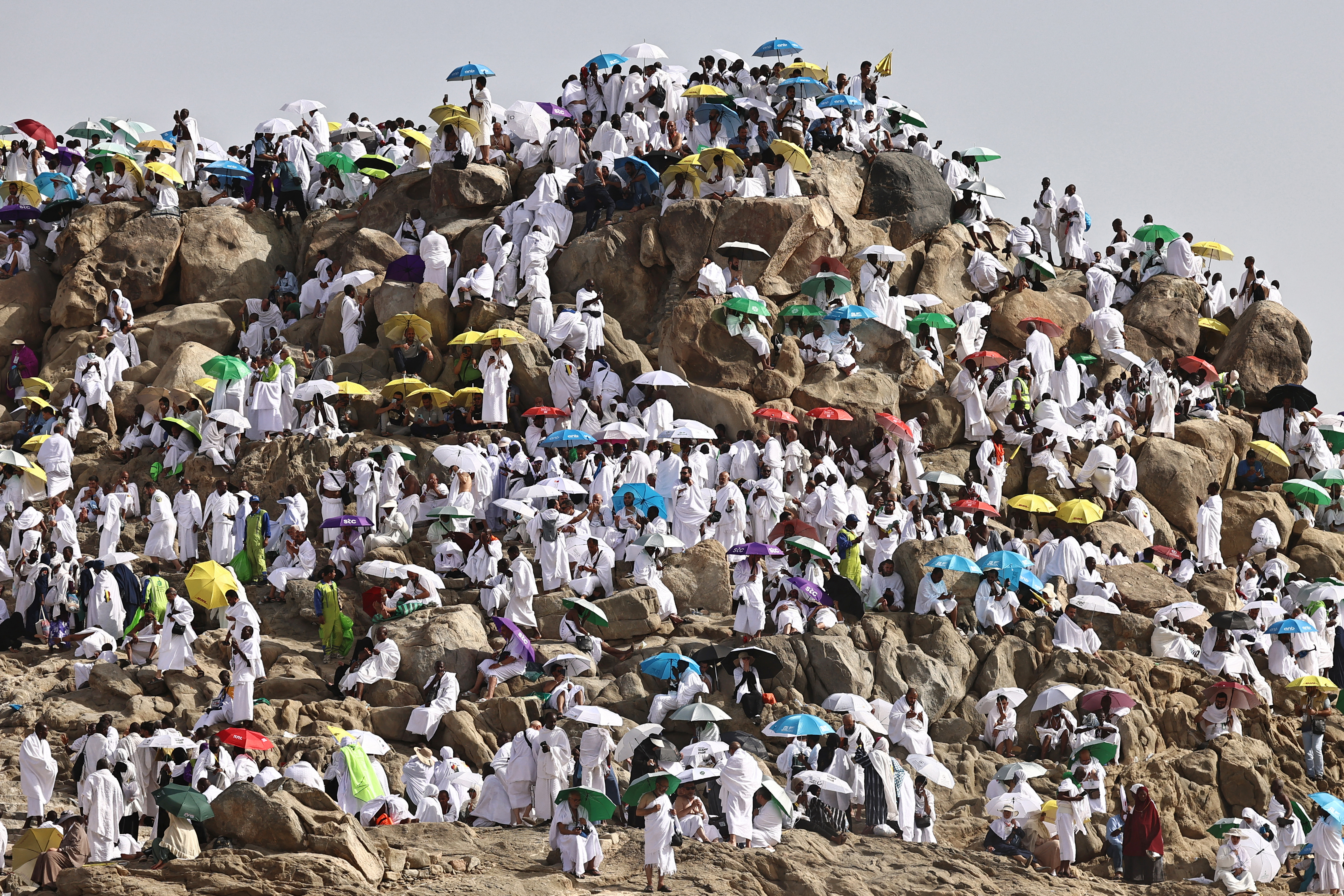 Hajj pilgrims gather at Mount Arafat under scorching desert sun