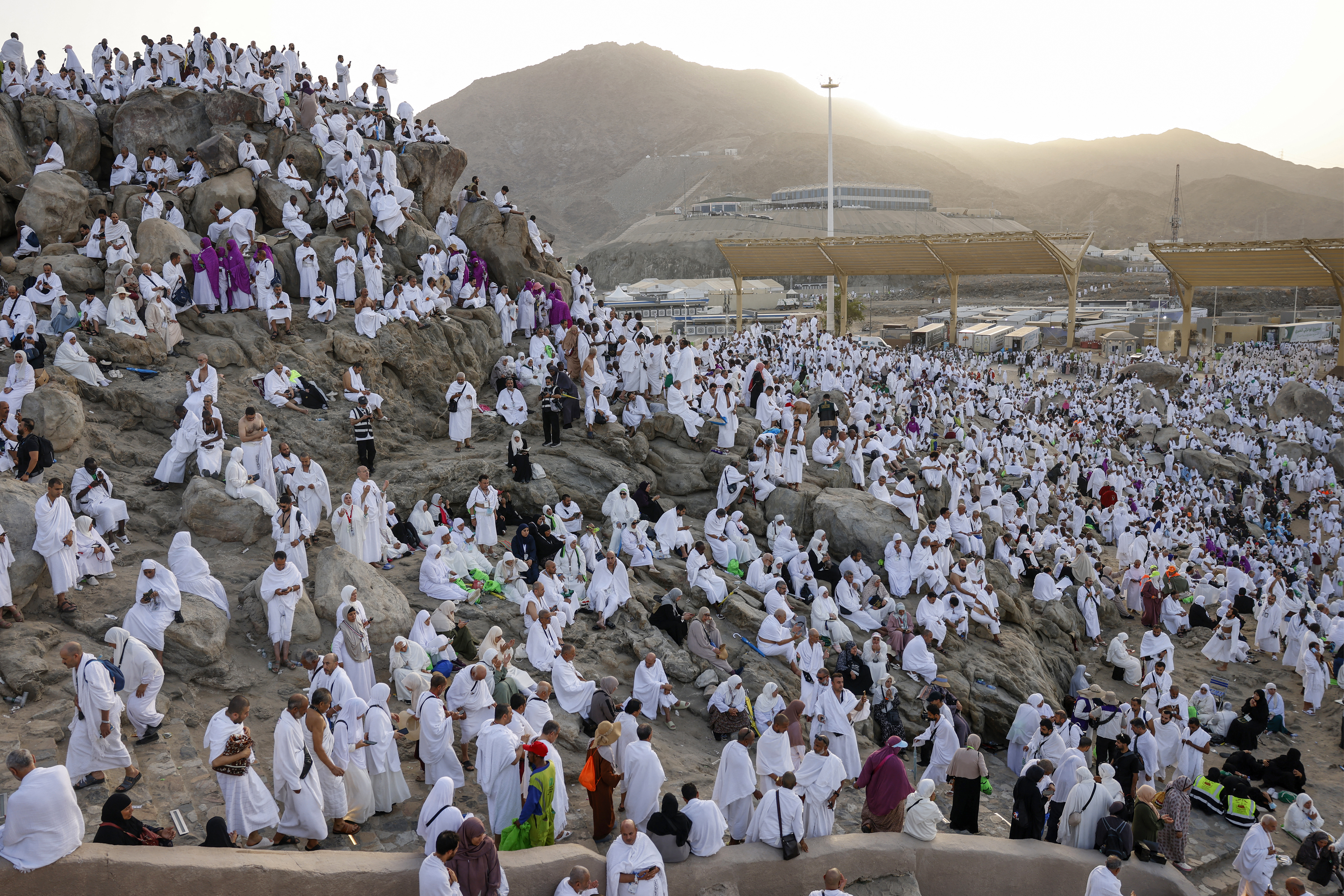 Hajj pilgrims gather at Mount Arafat under scorching desert sun