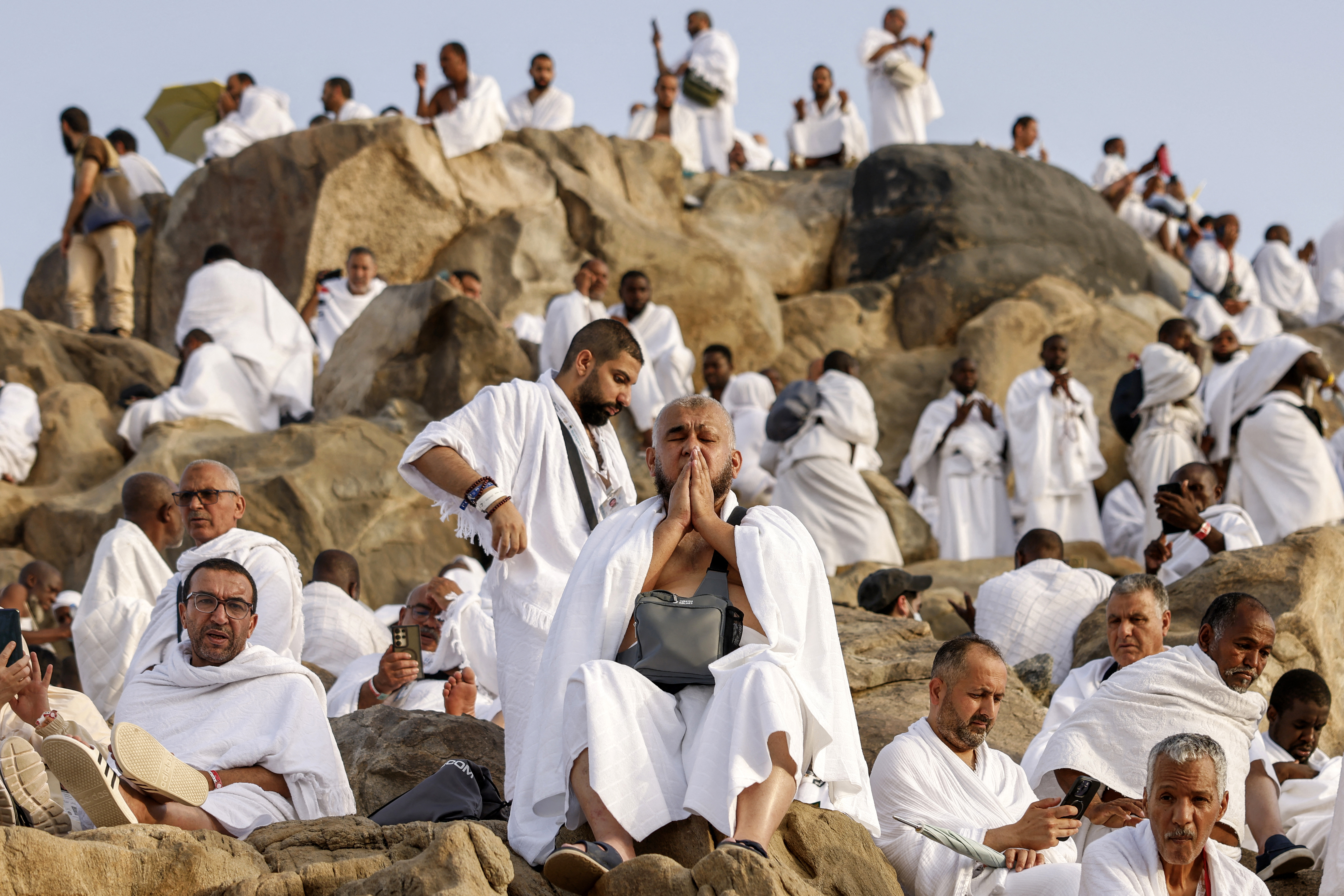 Hajj pilgrims gather at Mount Arafat under scorching desert sun