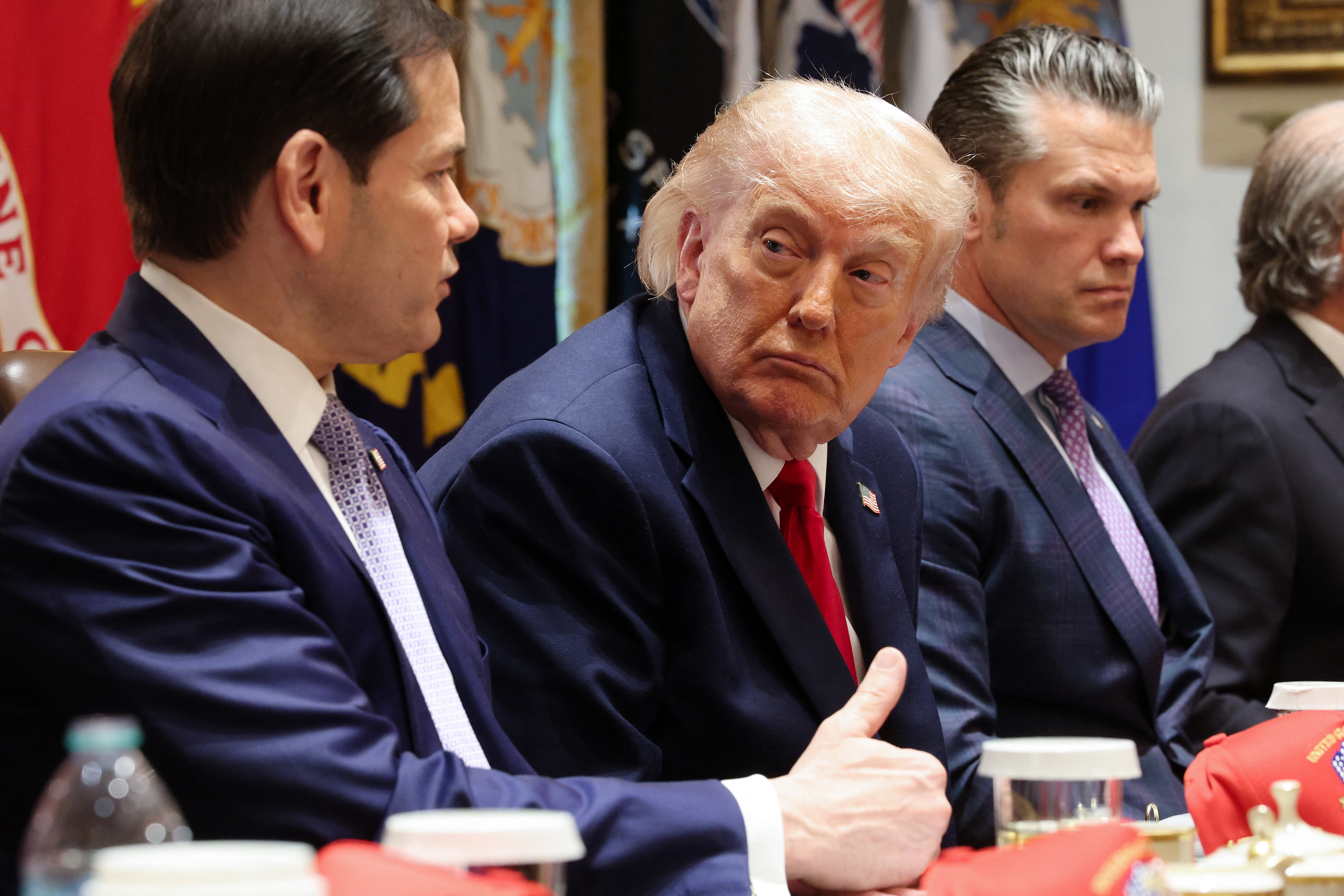 U.S. Secretary of State Marco Rubio (L) speaks as U.S. President Donald Trump and U.S. Secretary of War Pete Hegseth listen during a Cabinet meeting in the Cabinet Room of the White House on May 27, 2026 in Washington, DC. Trump meets with his Cabinet days after saying a peace deal with Iran was largely negotiated amid expectations around the re-opening the Strait of Hormuz.
